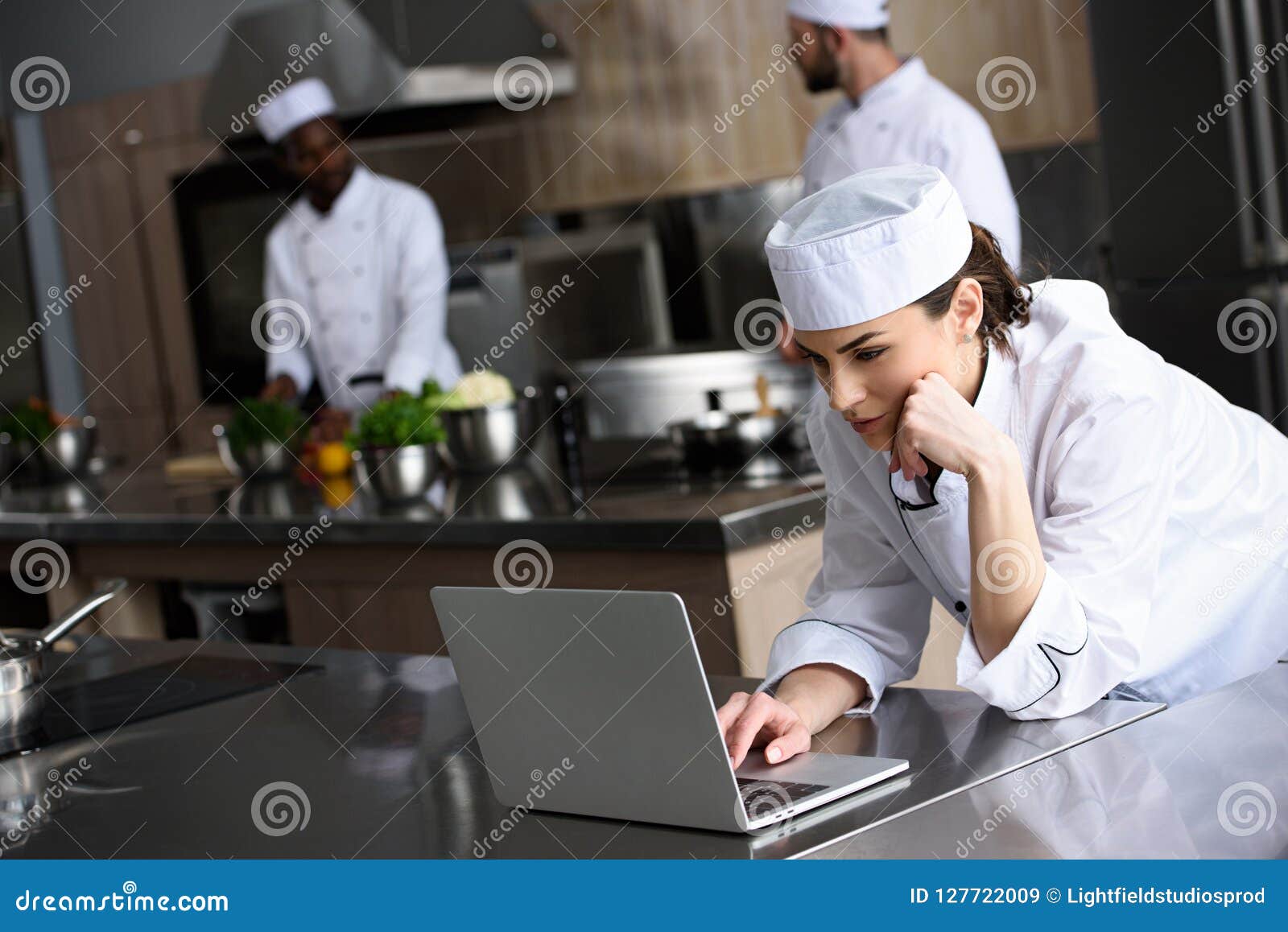 Attractive Chef Using Laptop Stock Image Image of team, cooks 127722009