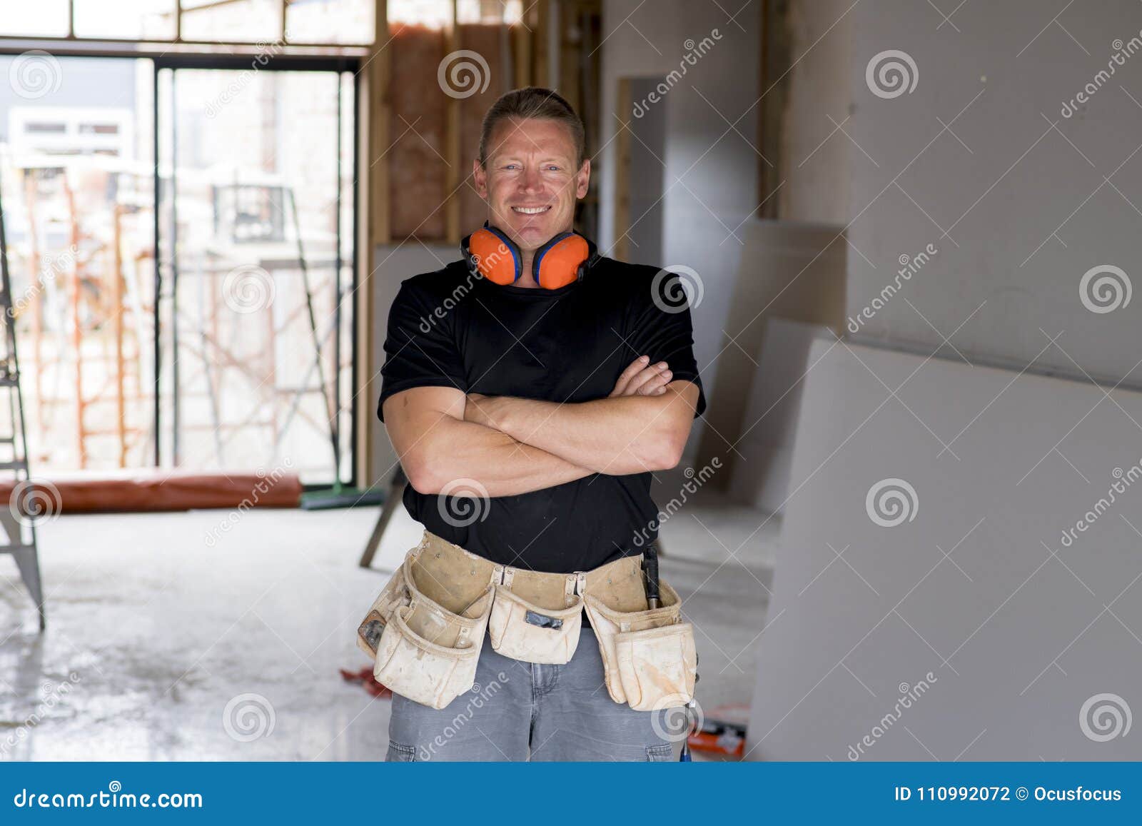 Attractive and Confident Constructor Carpenter or Builder Man with Ear