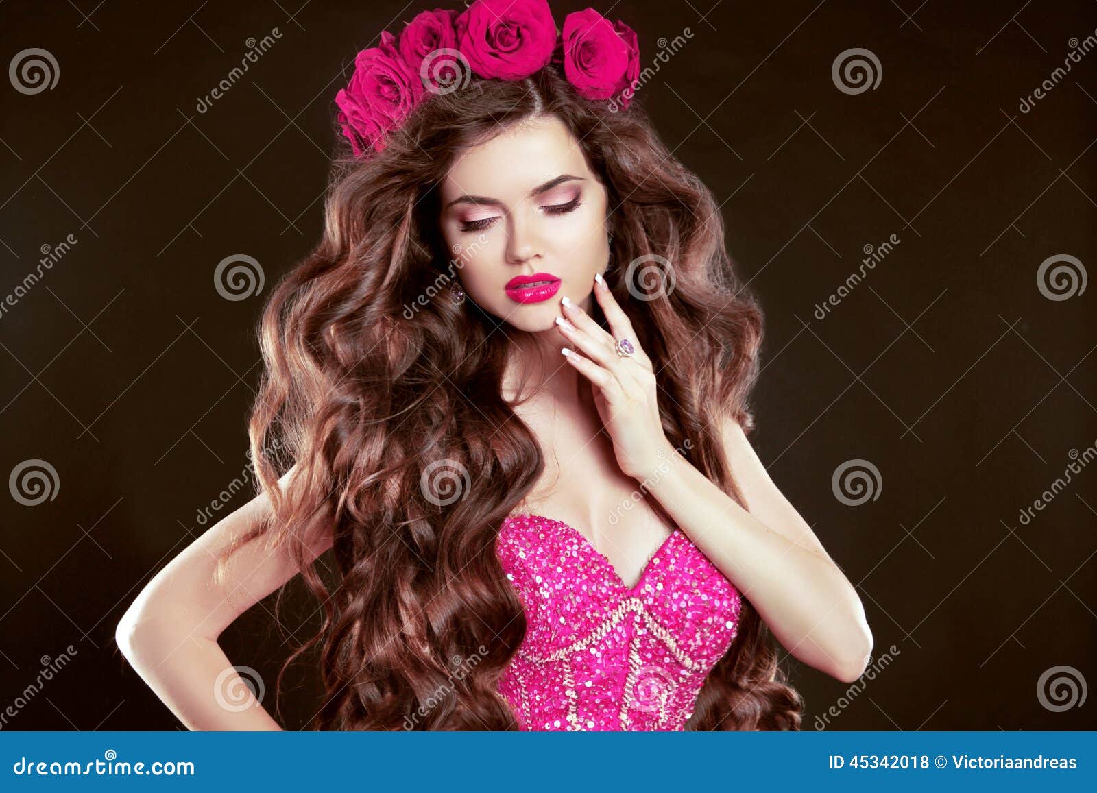 attractive girl with chaplet of roses on head, long wavy hair st