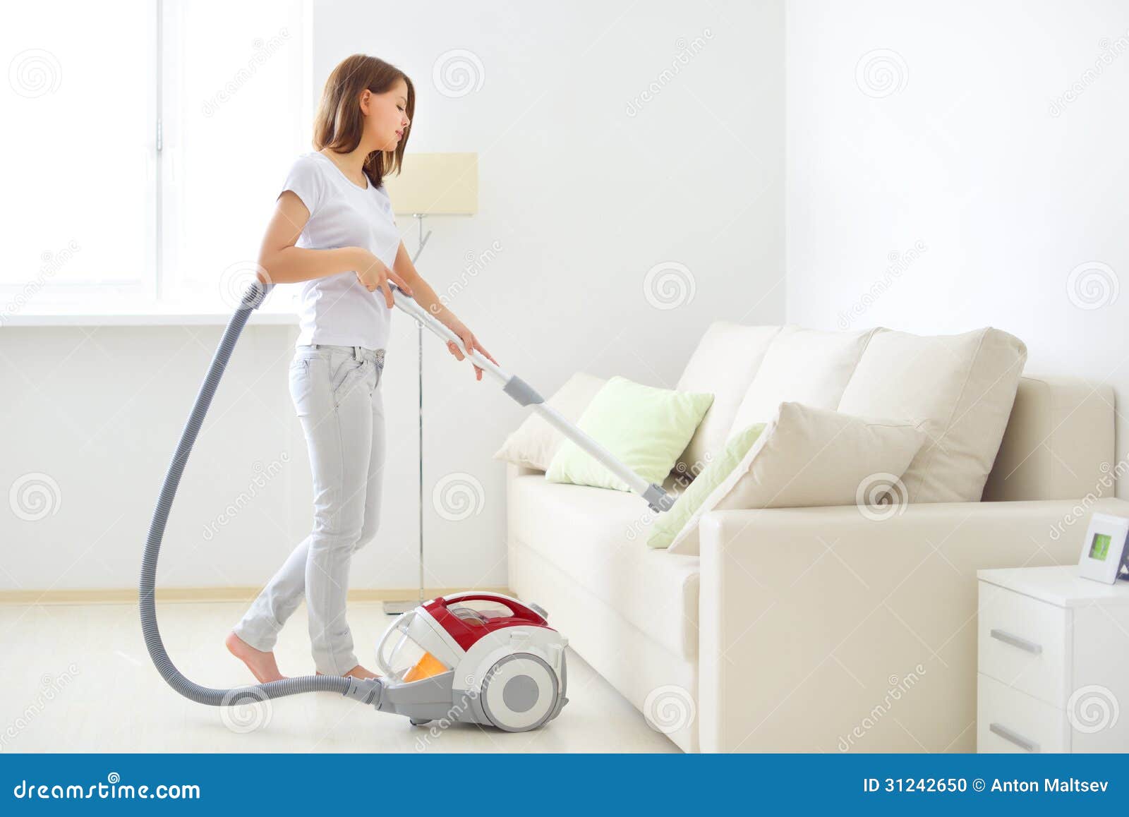 attractive girl with vacuum cleaner