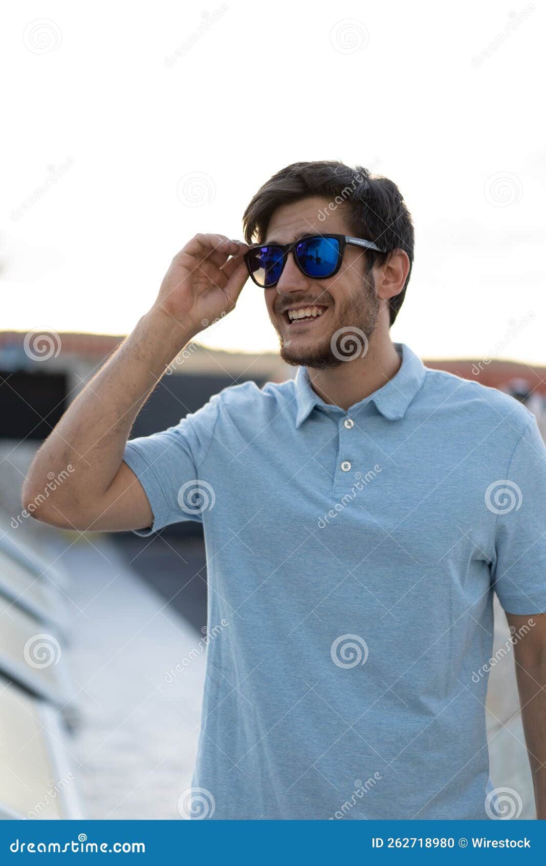 An Attractive Guy with Sunglass Posing for a Photo Stock Photo Image