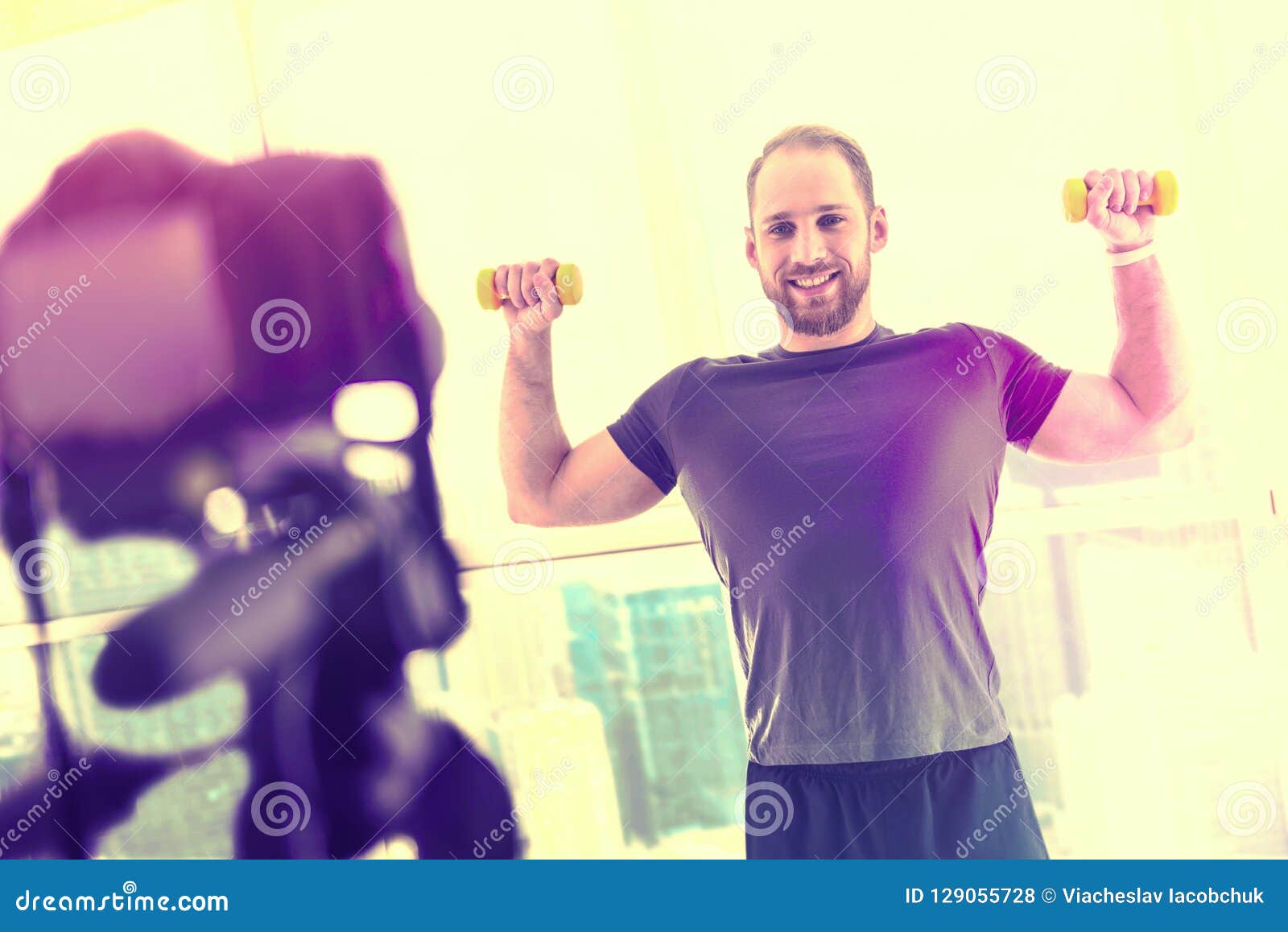 Attractive Handsome Man Exercising in Front of the Camera Stock Photo