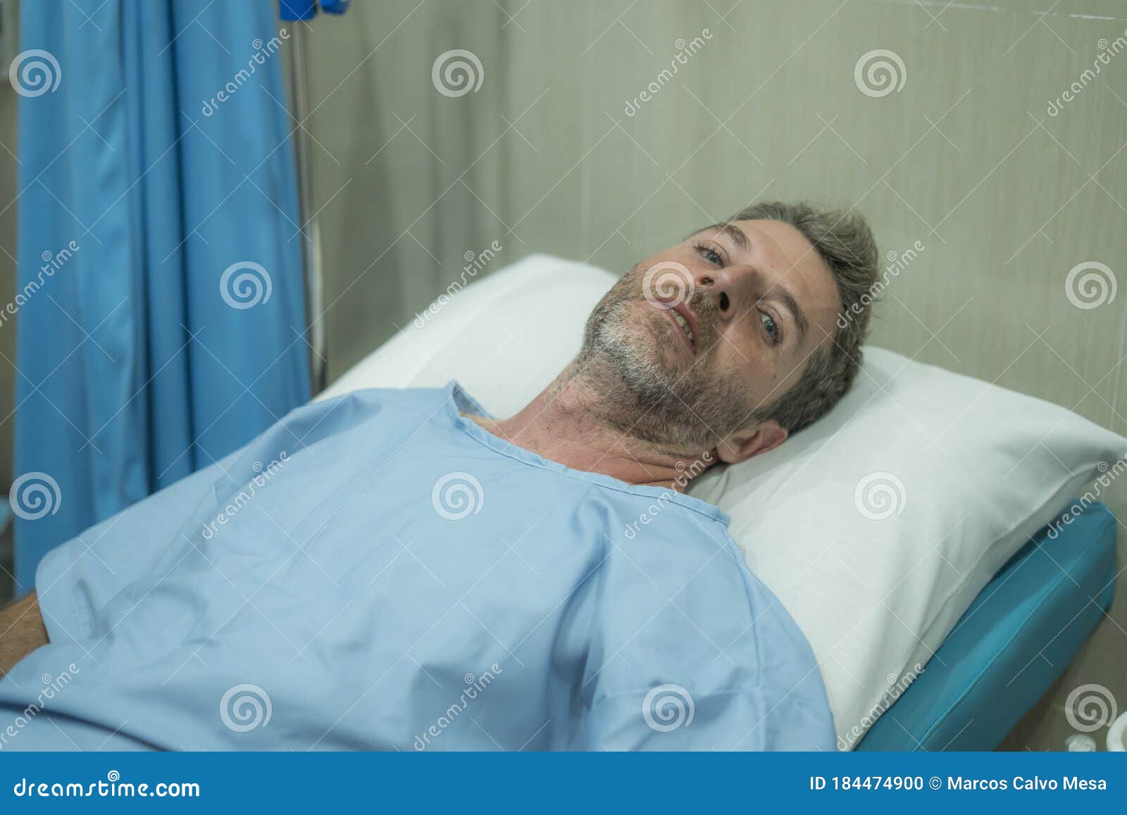 Attractive Injured Man Lying on Hospital Bed Receiving Treatment ...