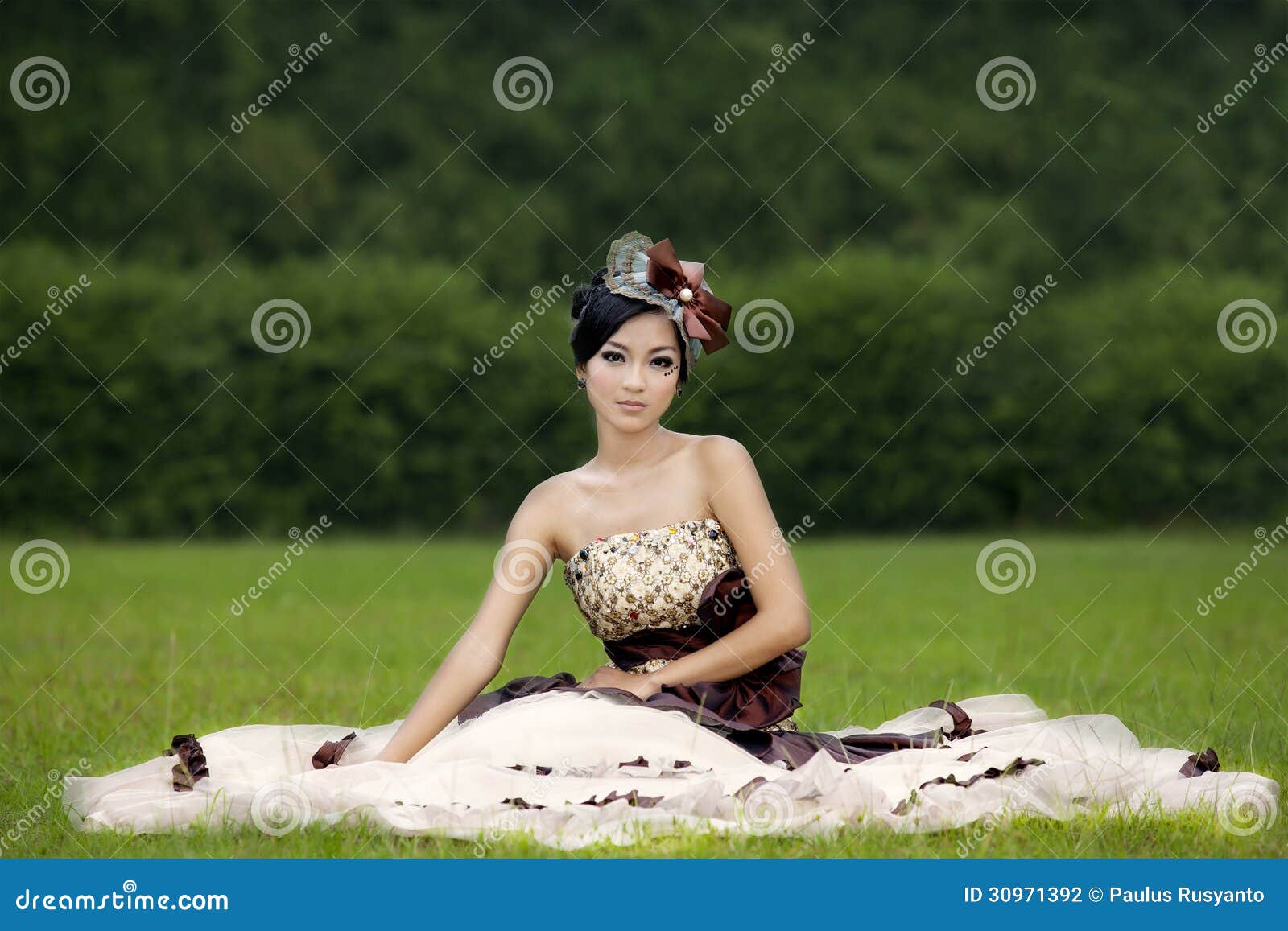 attractive lady in formal gown at park