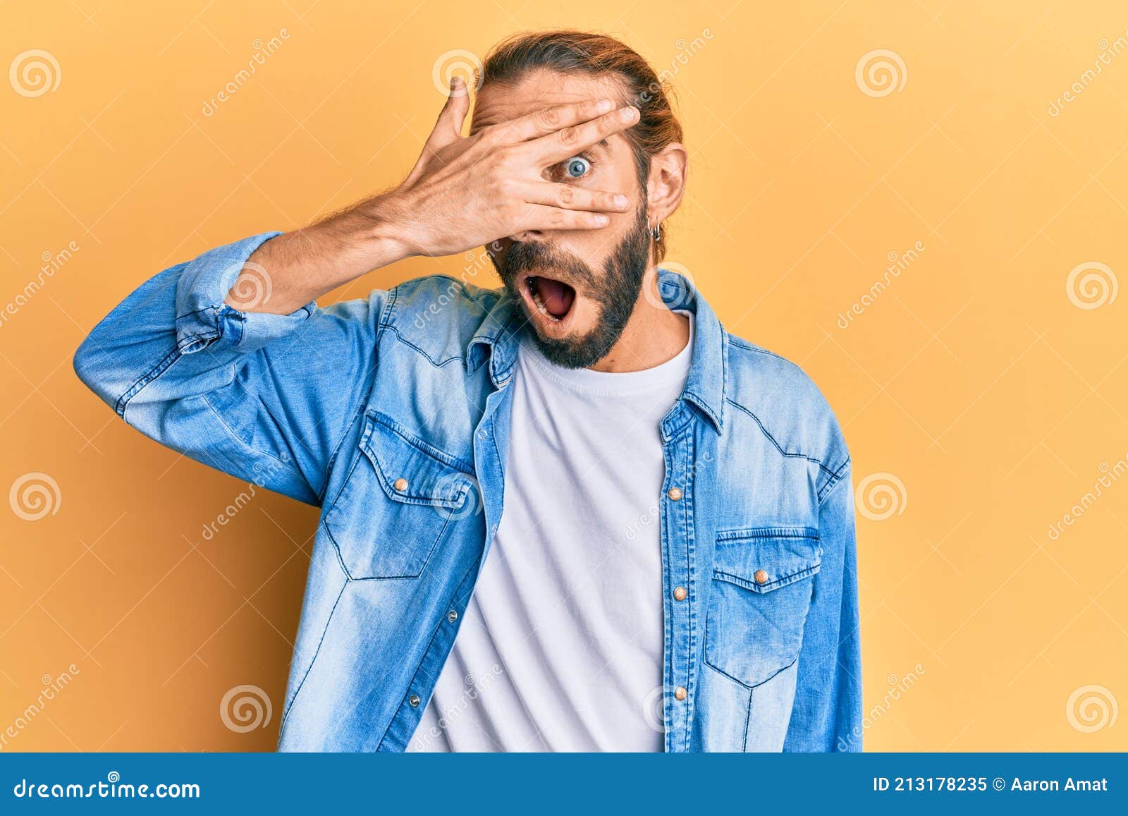 Attractive Man with Long Hair and Beard Wearing Casual Denim Jacket ...