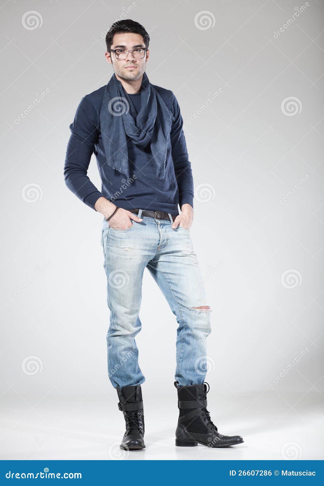 Cheerful handsome stylish young male model posing down on the stairs,  looking at camera. Stock Photo | Adobe Stock