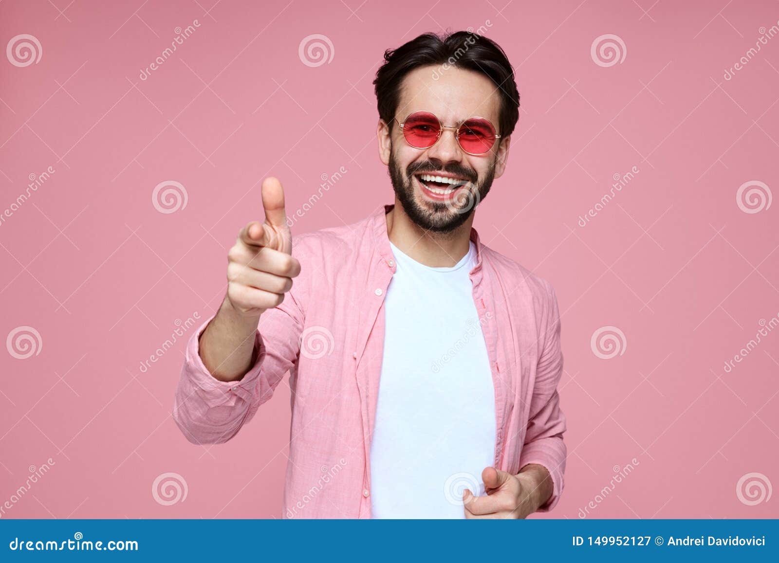 Attractive Man, Wearing Pink Shirt and Sunglasses, Smiling and Pointing ...