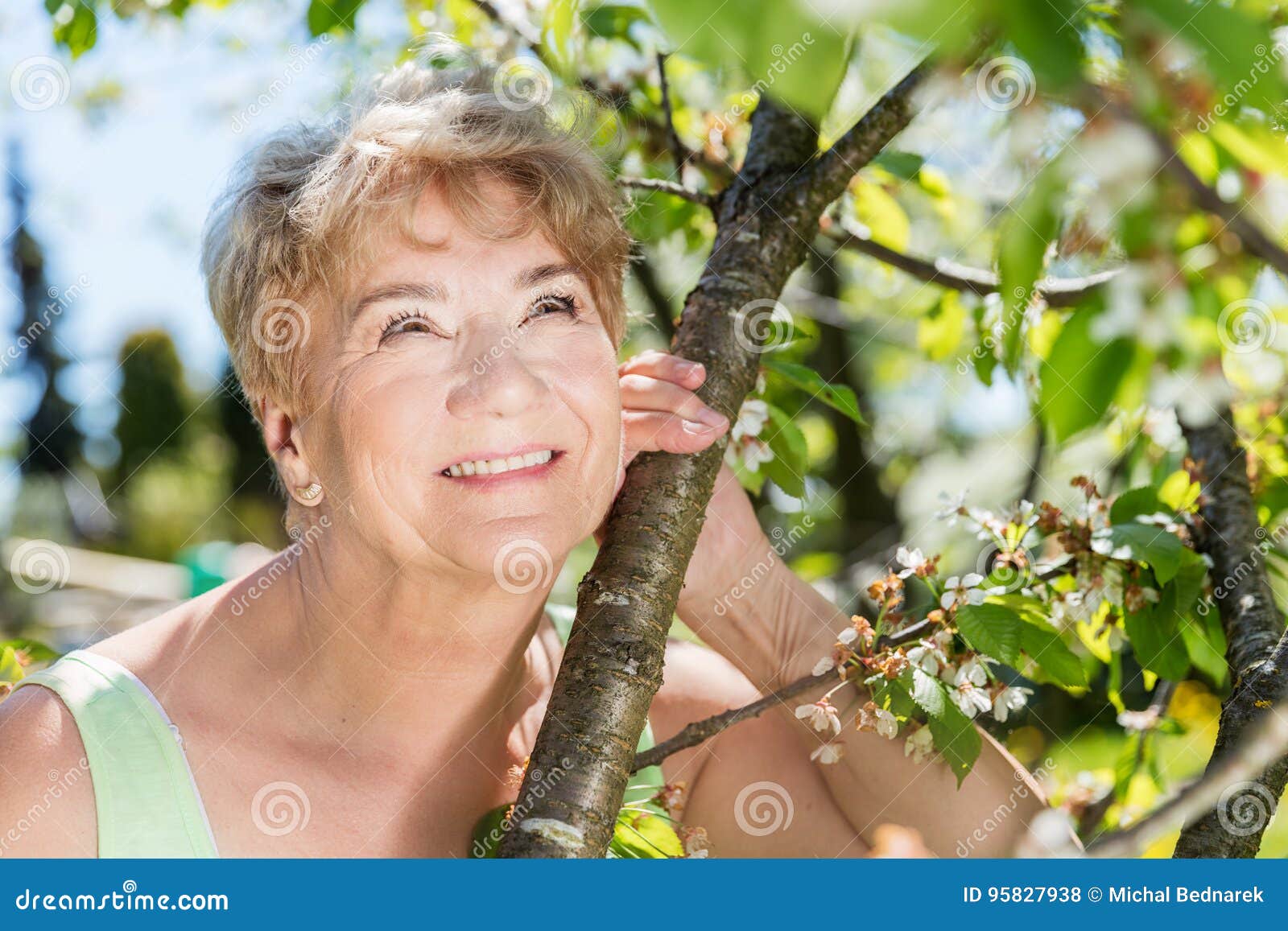 Attractive Mature Woman Embracing Nature. Grandmother Stock Photo