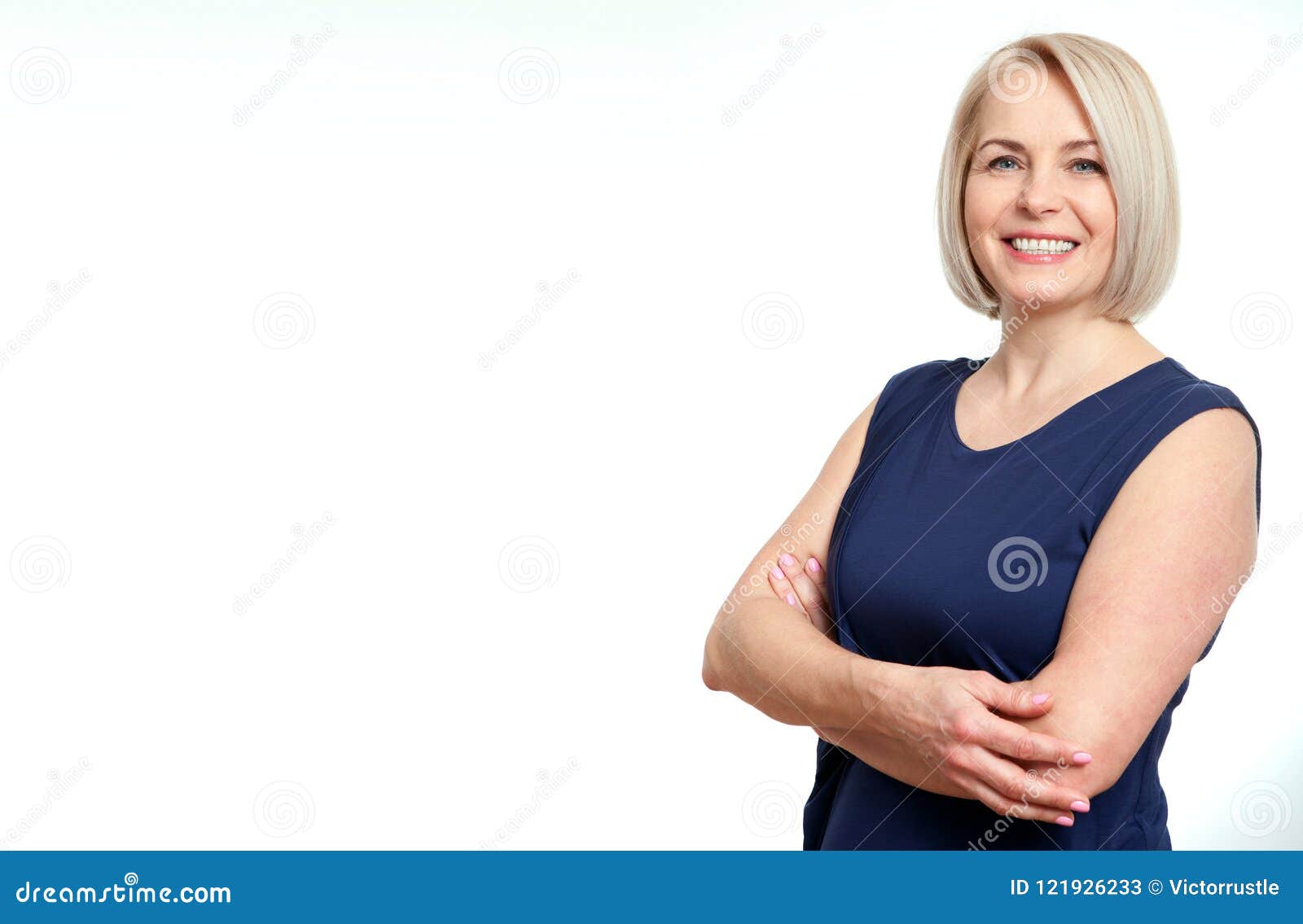 attractive middle aged woman with folded arms on white background