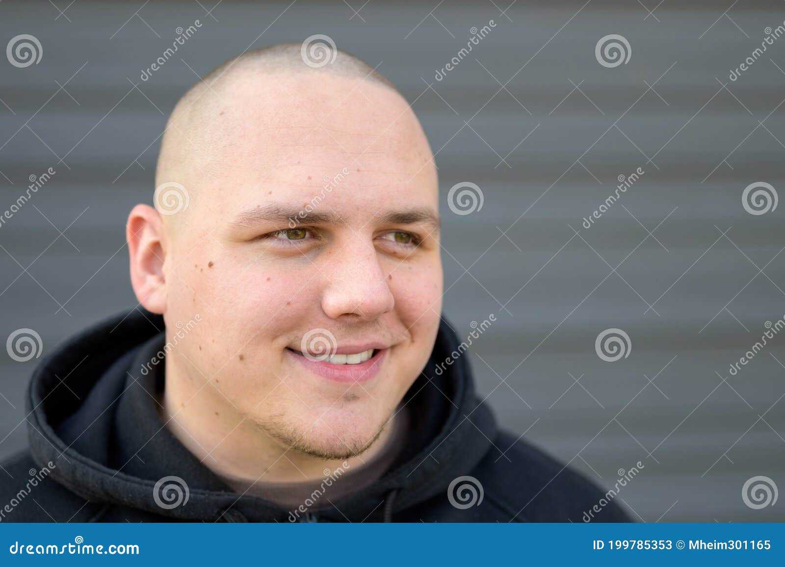 Young man shaved head