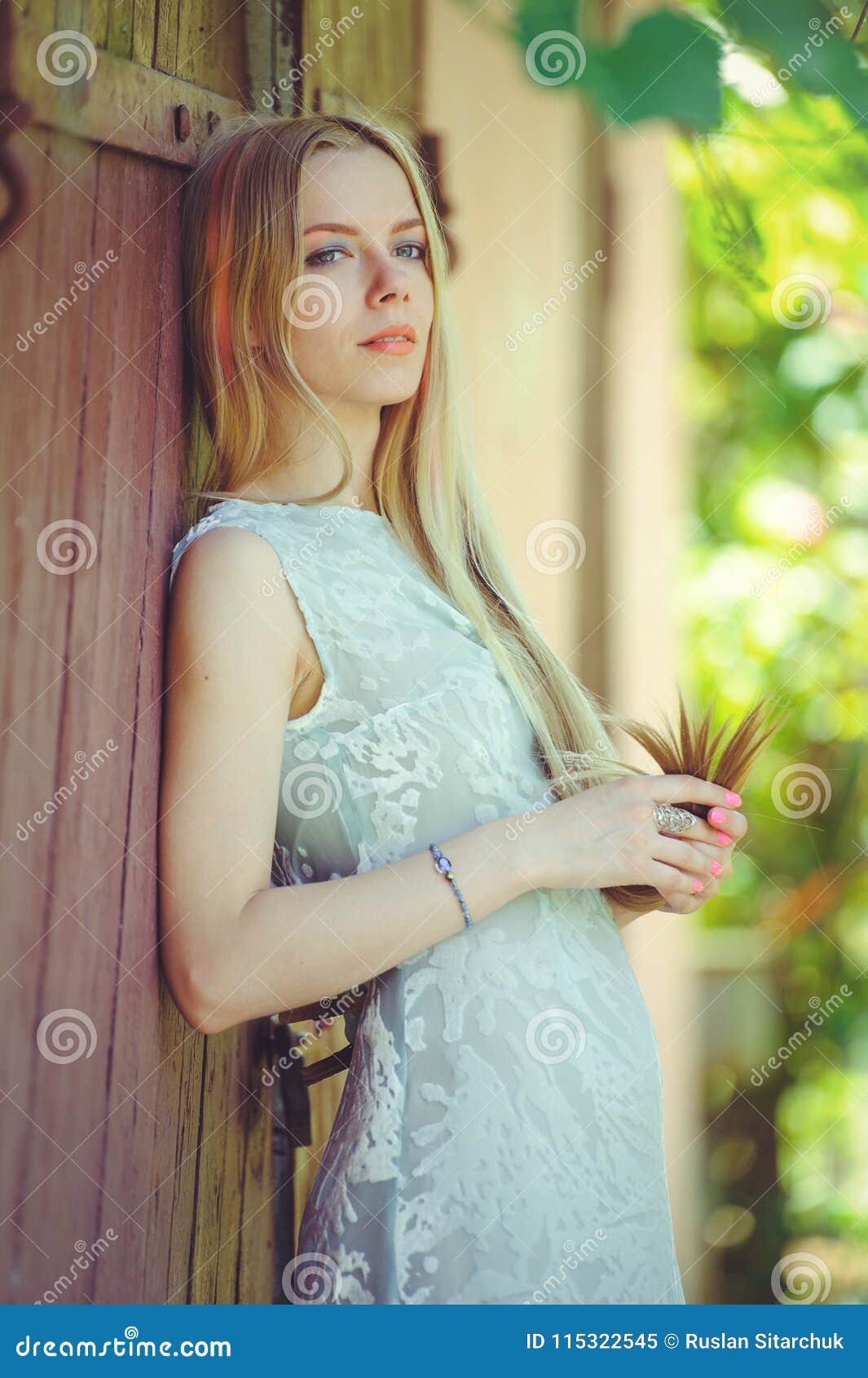 Attractive Modest Young Blond Woman on Red Wooden Background Her Hair ...