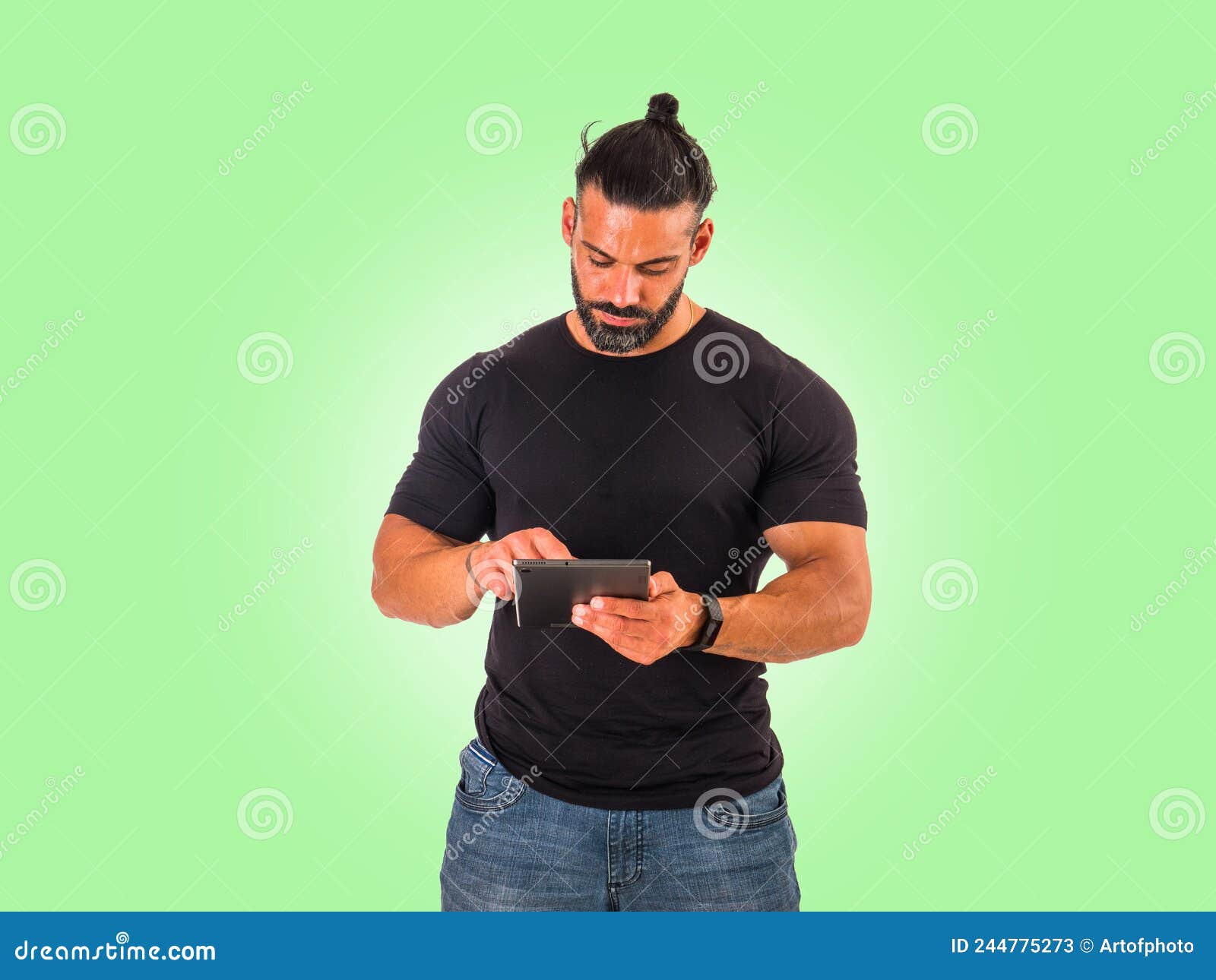 Attractive Muscular Man Using Electronic Tablet in Studio Stock Image ...