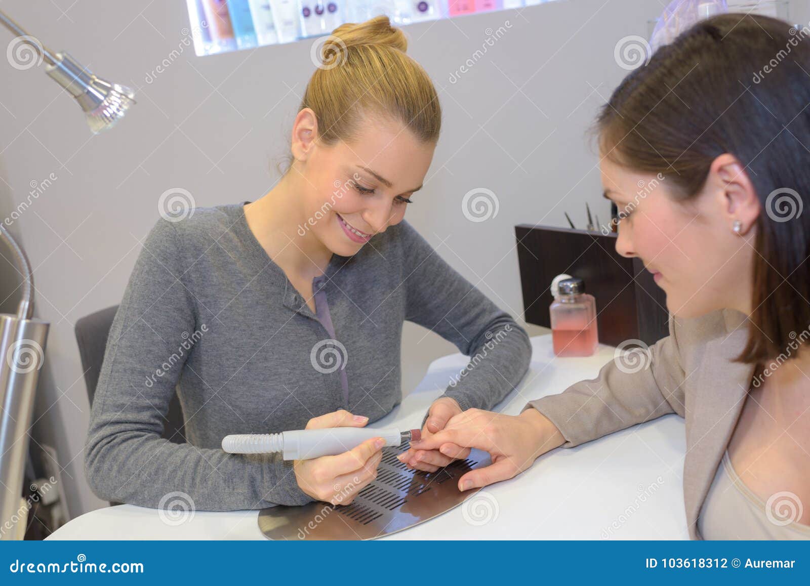 Attractive Nail Salon Worker Giving Manicure Stock Photo Image of