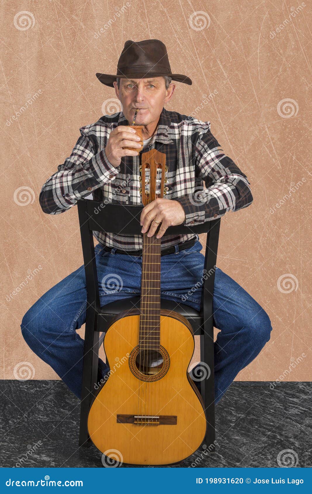 attractive old man rural style taking the infusion called mate