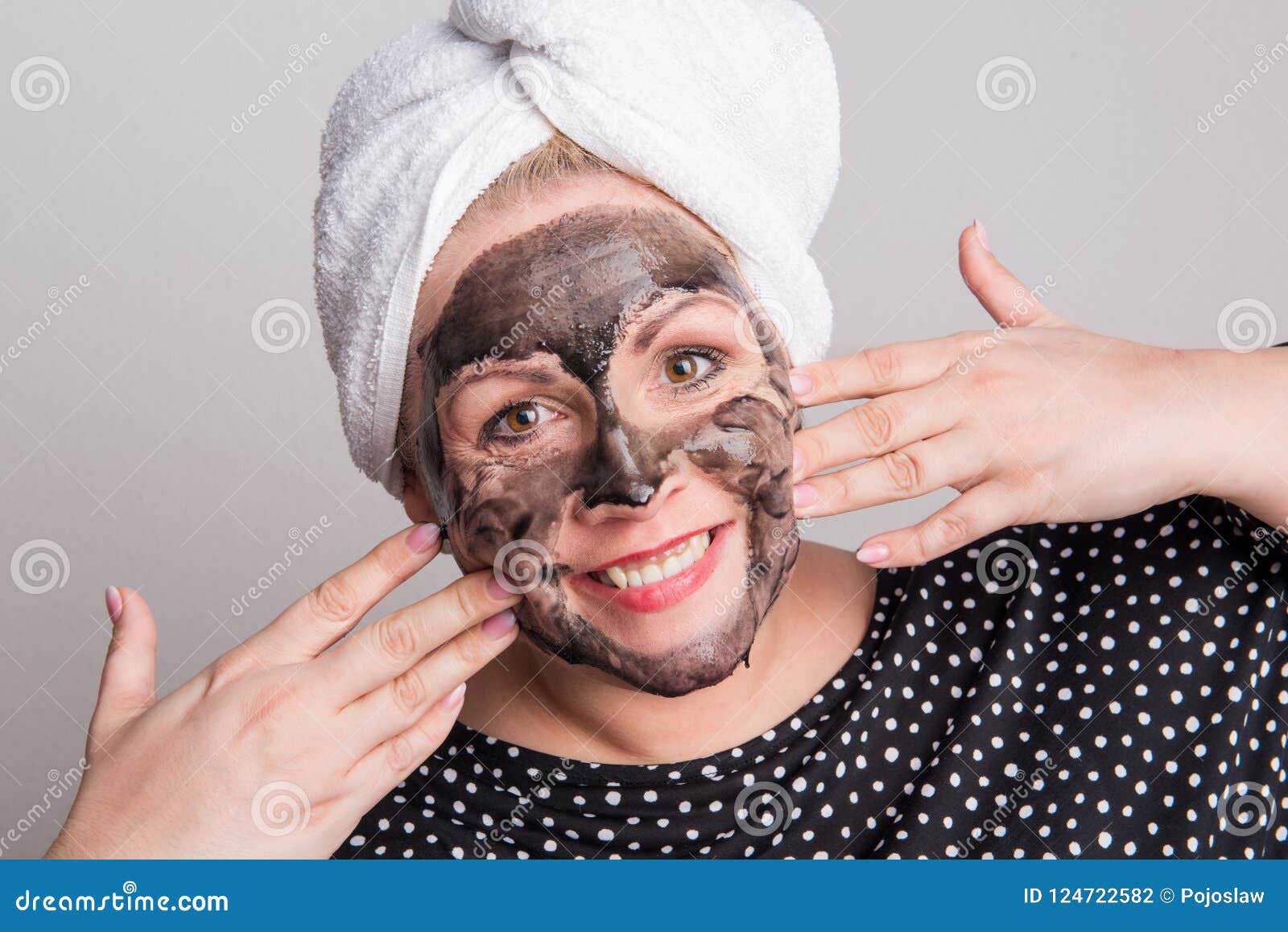 An Attractive Overweight Woman with Black Facial Mask on Her Face in a ...