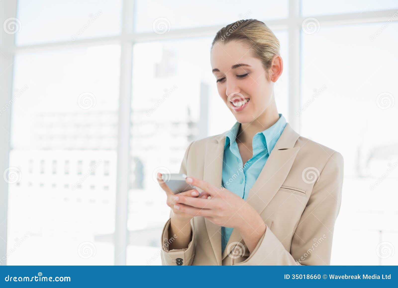 Attractive Ponytailed Businesswoman Texting with Her Smartphone Stock ...