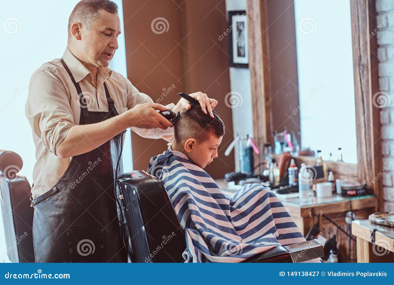 Attractive School Boy Is Getting Trendy Haircut From Mature