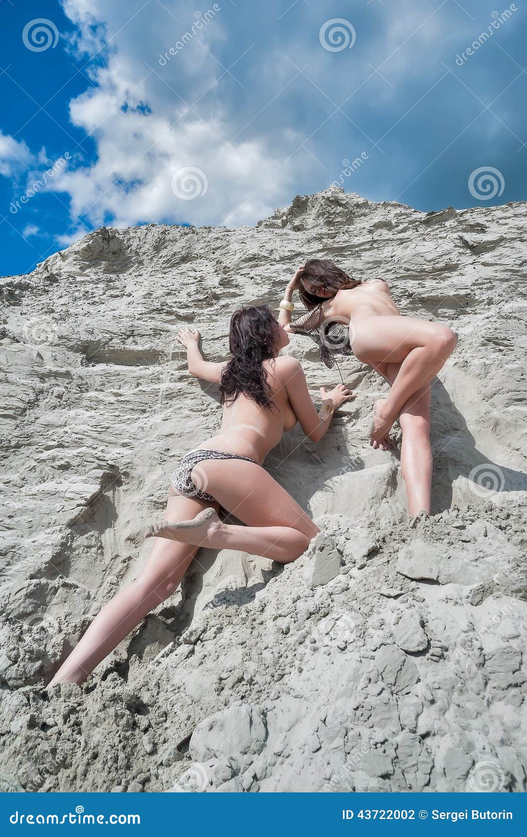 Appealing naked babes are relaxing on the beach