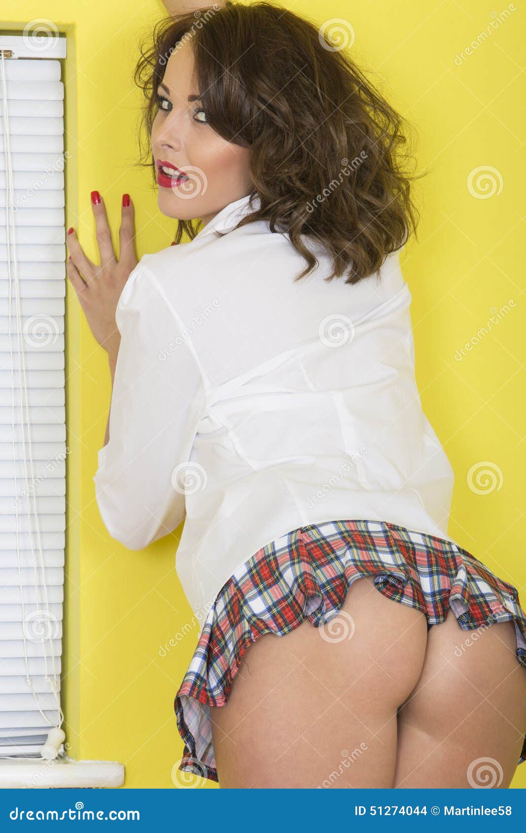 Attractive Young PIn Up Model Wearing Short Mini Skirt Bend Stock Photo -  Image of raised, attractive: 51274044