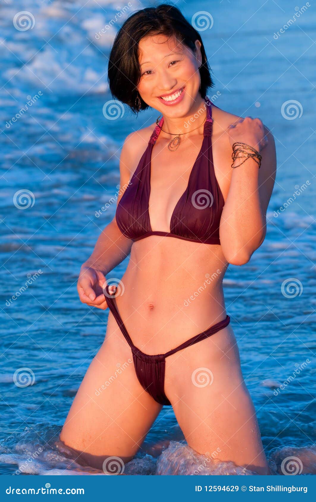 Attractive Smiling Asian Woman in Bikini Stock Image pic