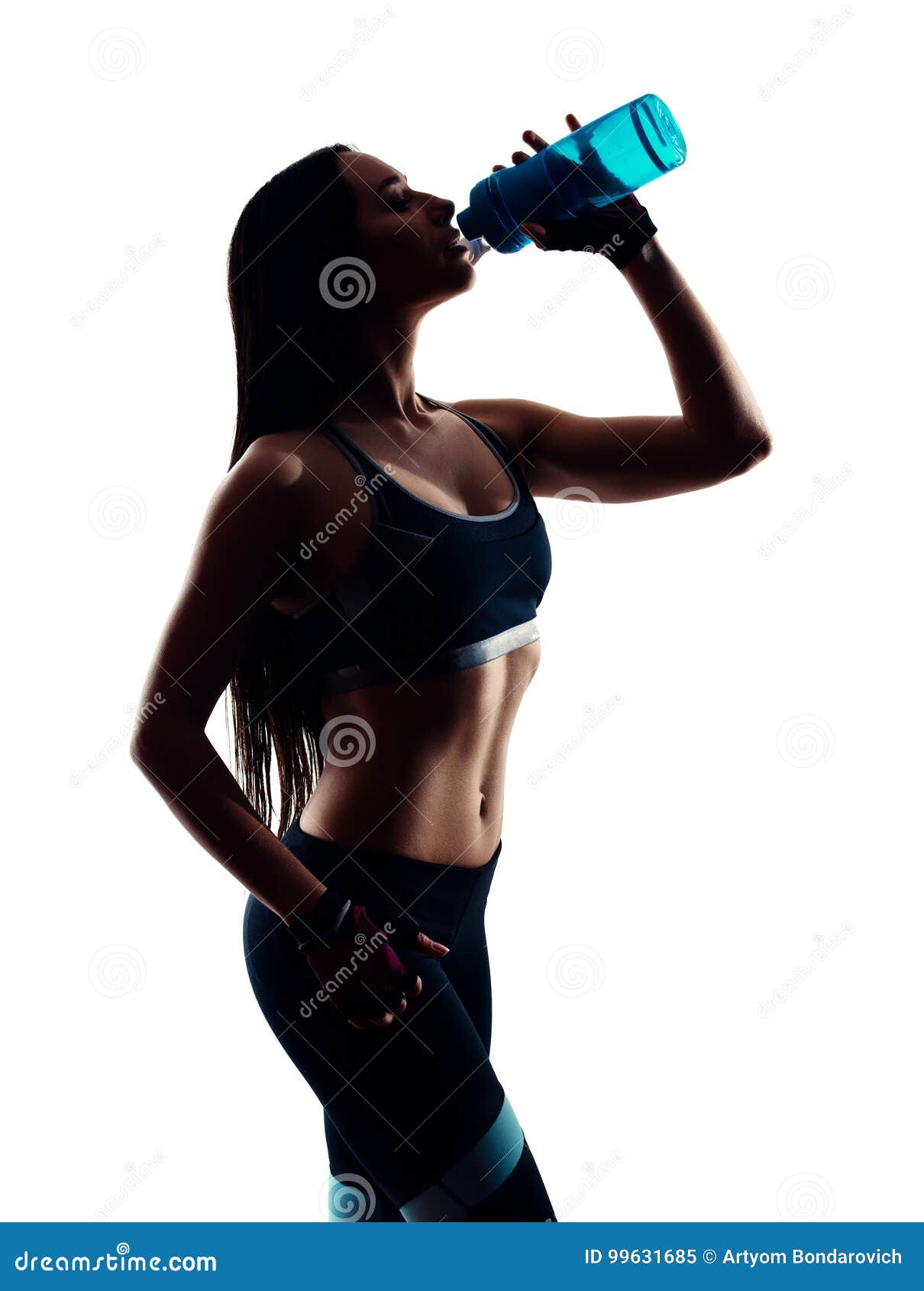 Attractive Sporty Young Woman Drinking from Blue Shaker Bottle in