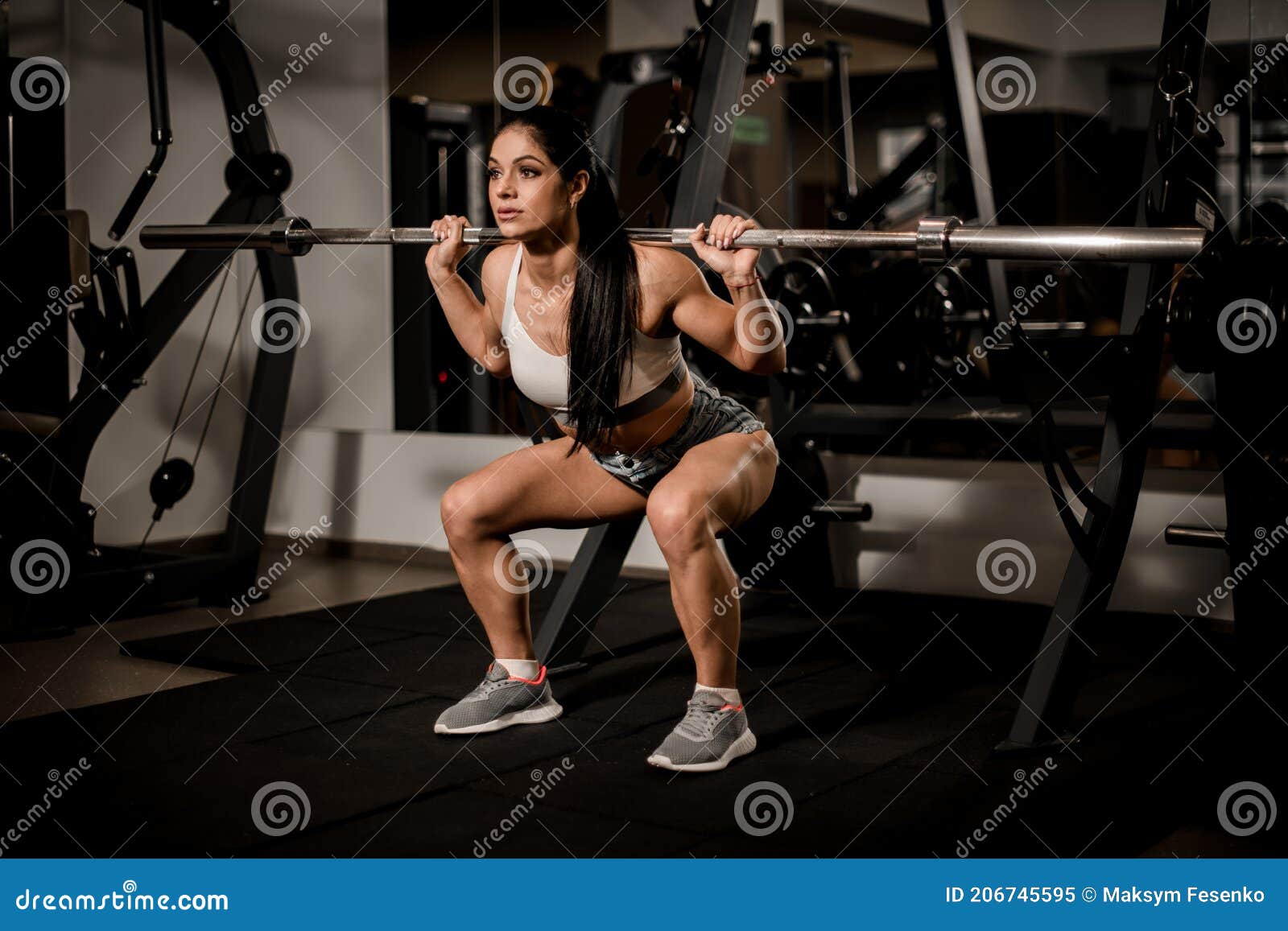 Close-up of Strong Muscular Arm of Woman Bodybuilder Who Train on Simulator  in Fitness Club Stock Photo - Image of bodybuilding, bodybuilder: 204288532