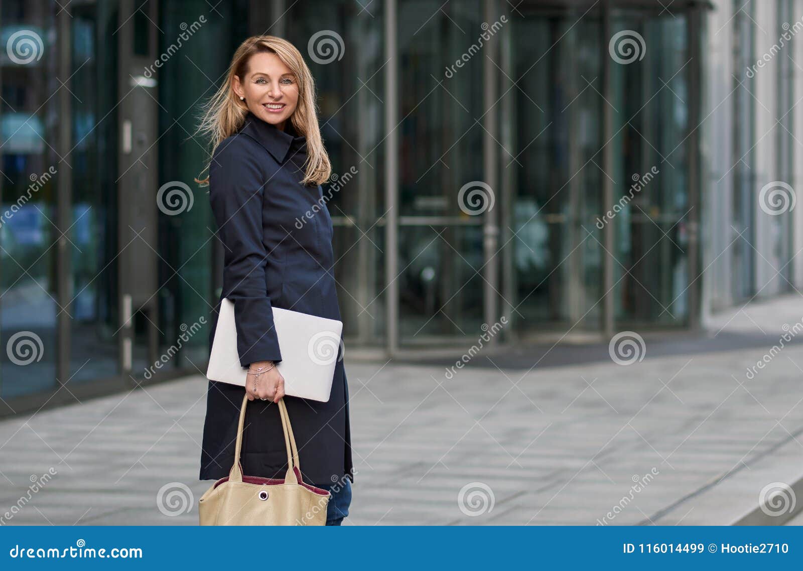 Attractive Stylish Blond Businesswoman Walking through Town Stock Image ...