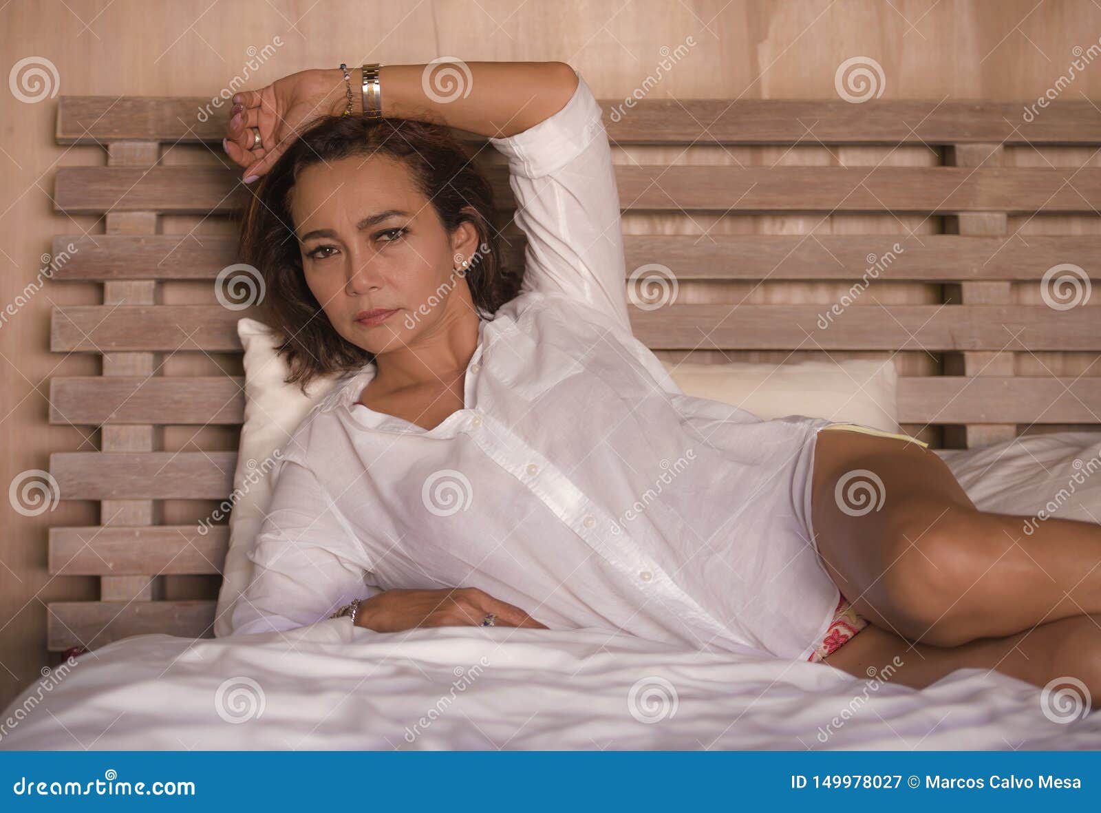 Attractive Successful and Mature Woman Aged 50s To 60s Relaxed and  Confident at Home Bedroom Lying on Bed in the Morning Stock Image - Image  of relax, lady: 149978027