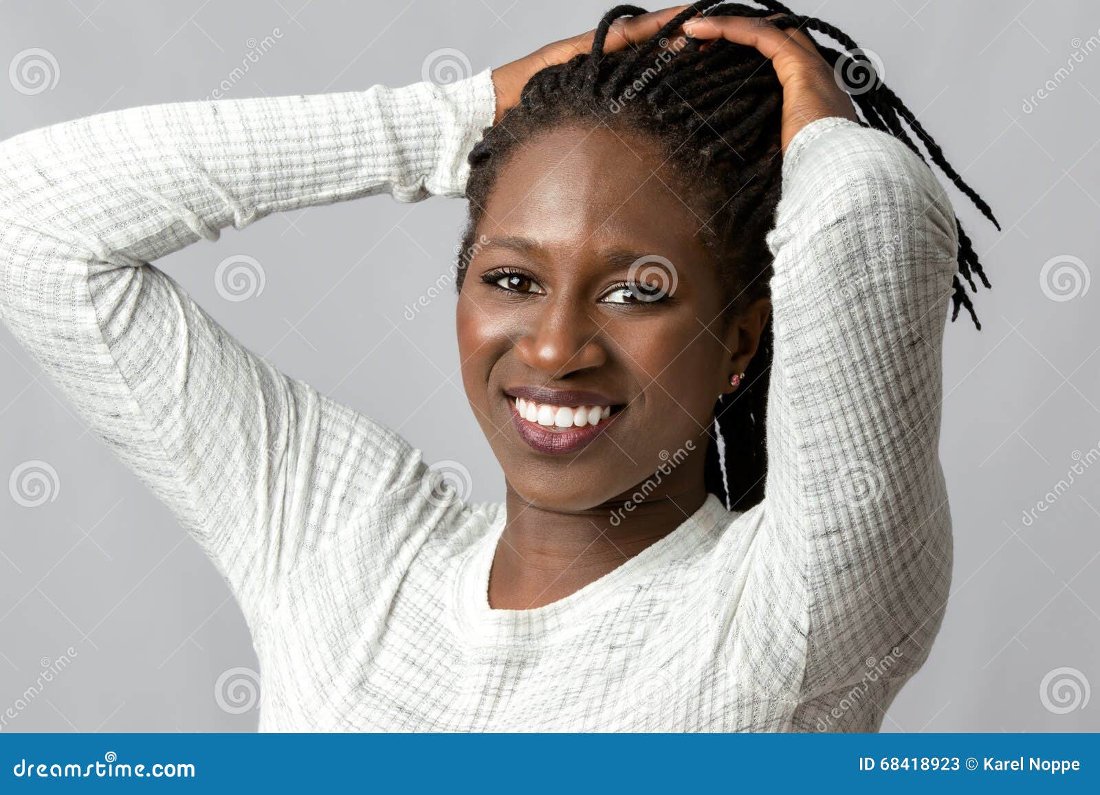 Attractive Teen Girl With Hands In Braided Hair Stoc