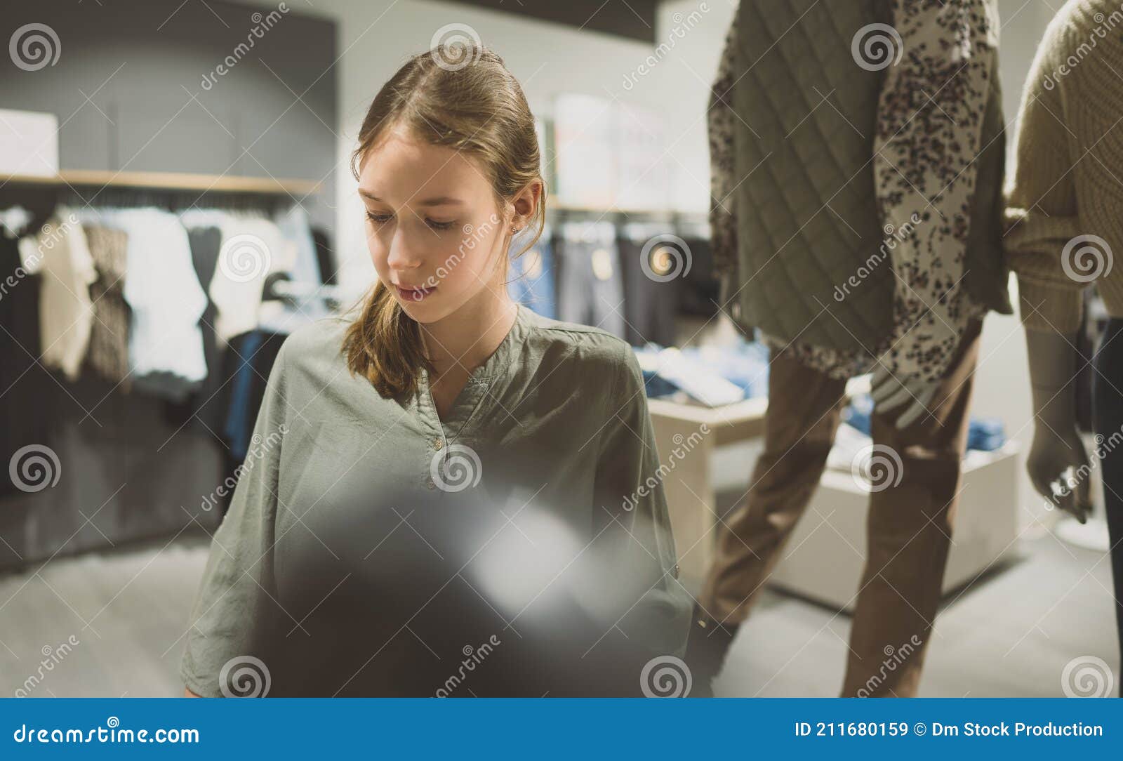 Girl in a clothing store stock image. Image of mall 211680159