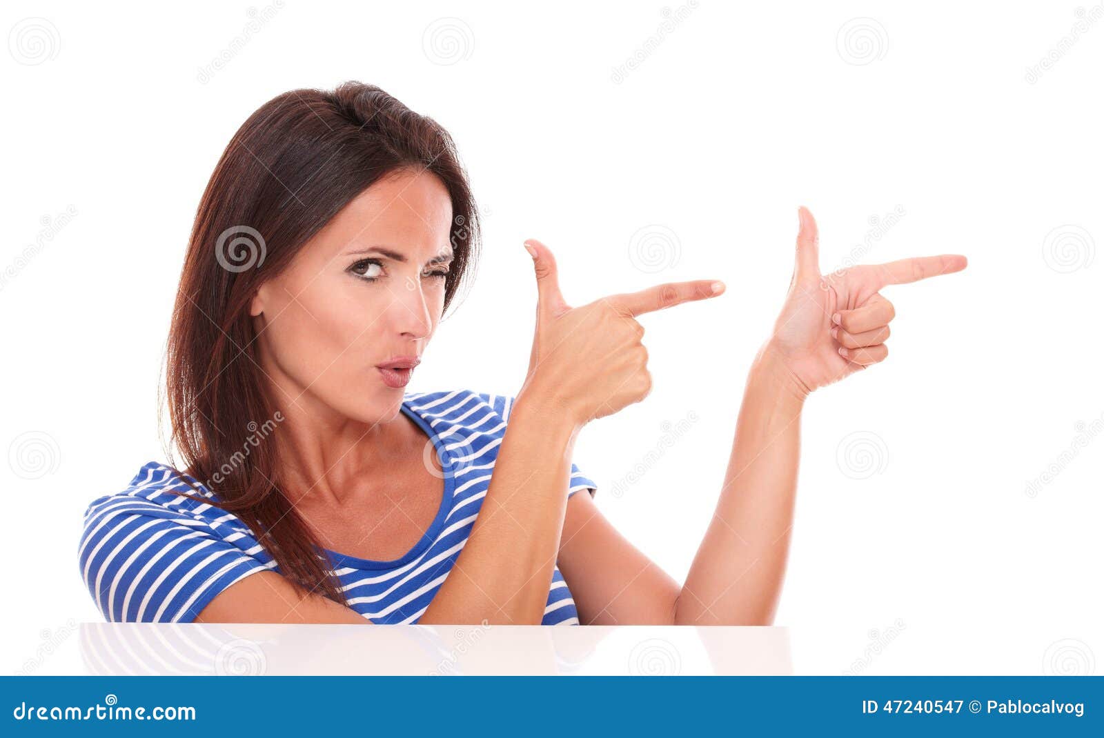 attractive winking woman pointing to her left