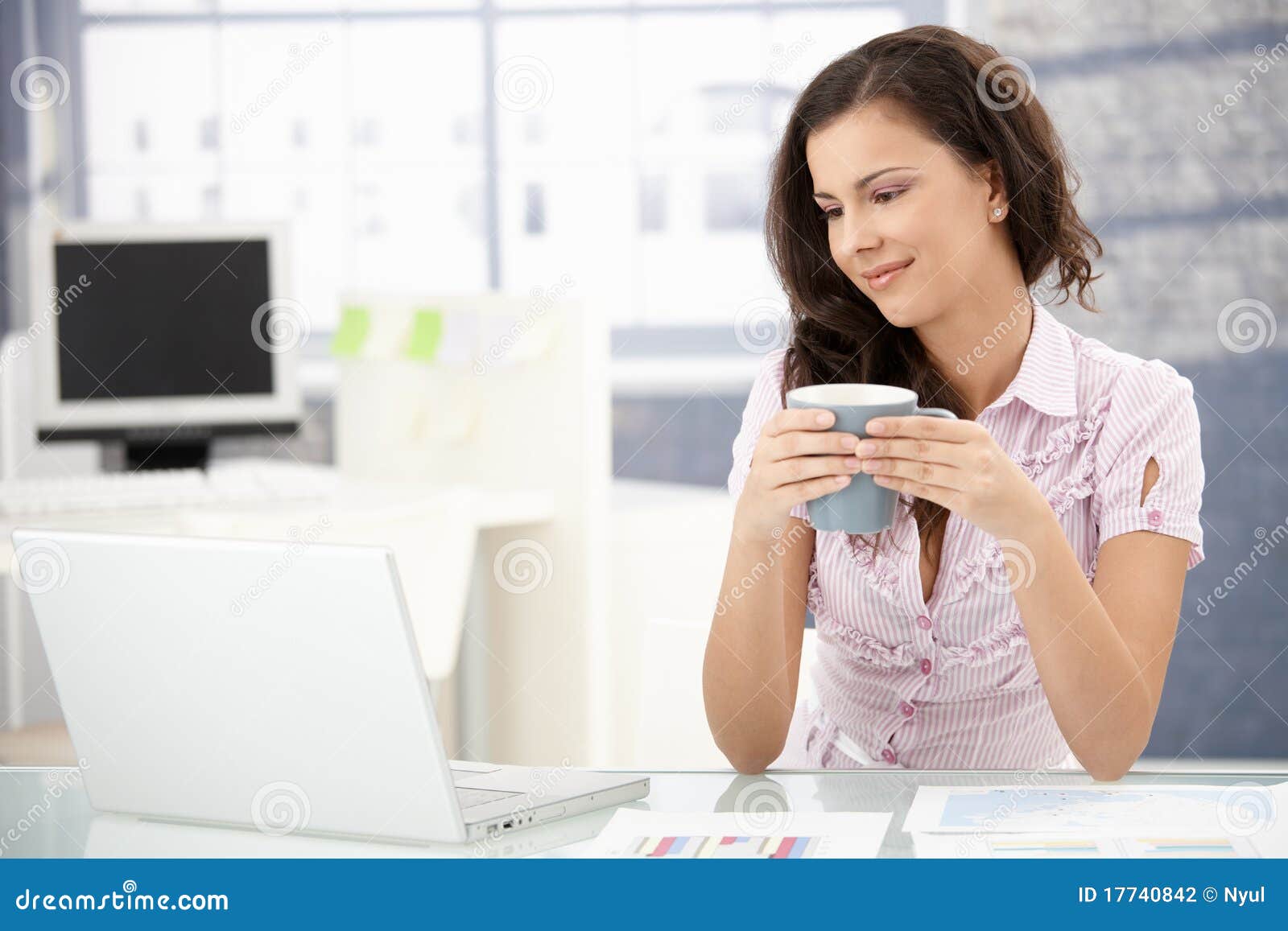 attractive woman browsing internet in office