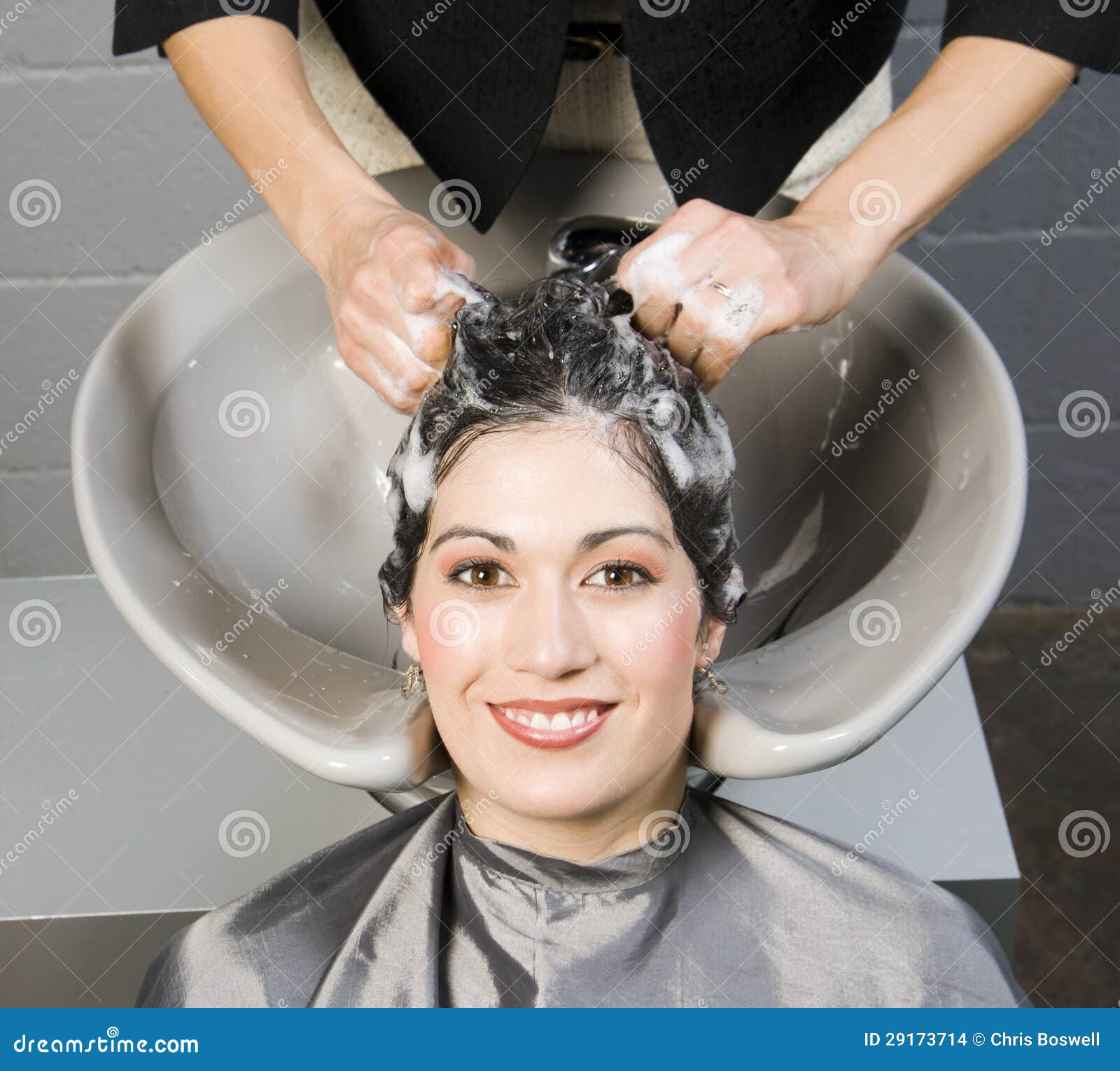 Attractive Woman Gets Spa Salon Shampoo and Conditioning Stock Photo