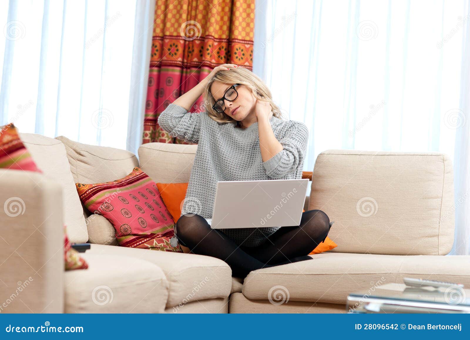 attractive woman with laptop having neck pain