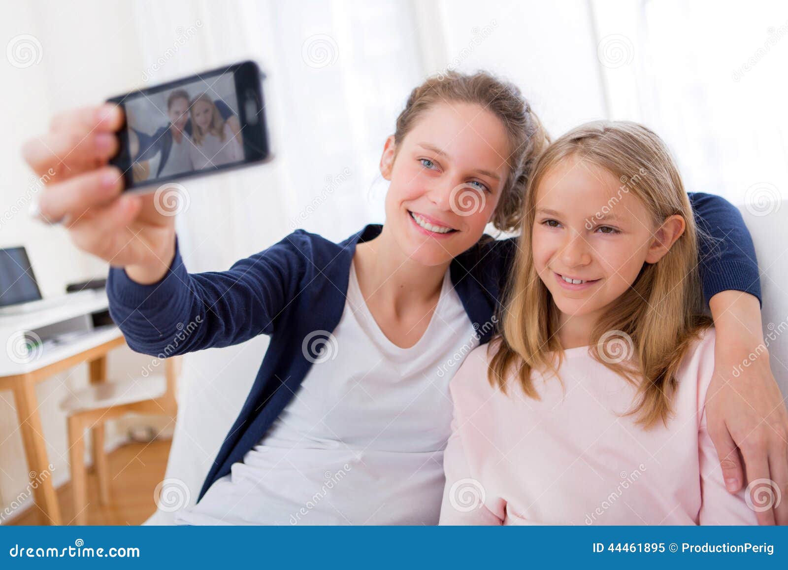 Attractive Woman and Little Sister Taking Selfie Stock Image - Image of ...