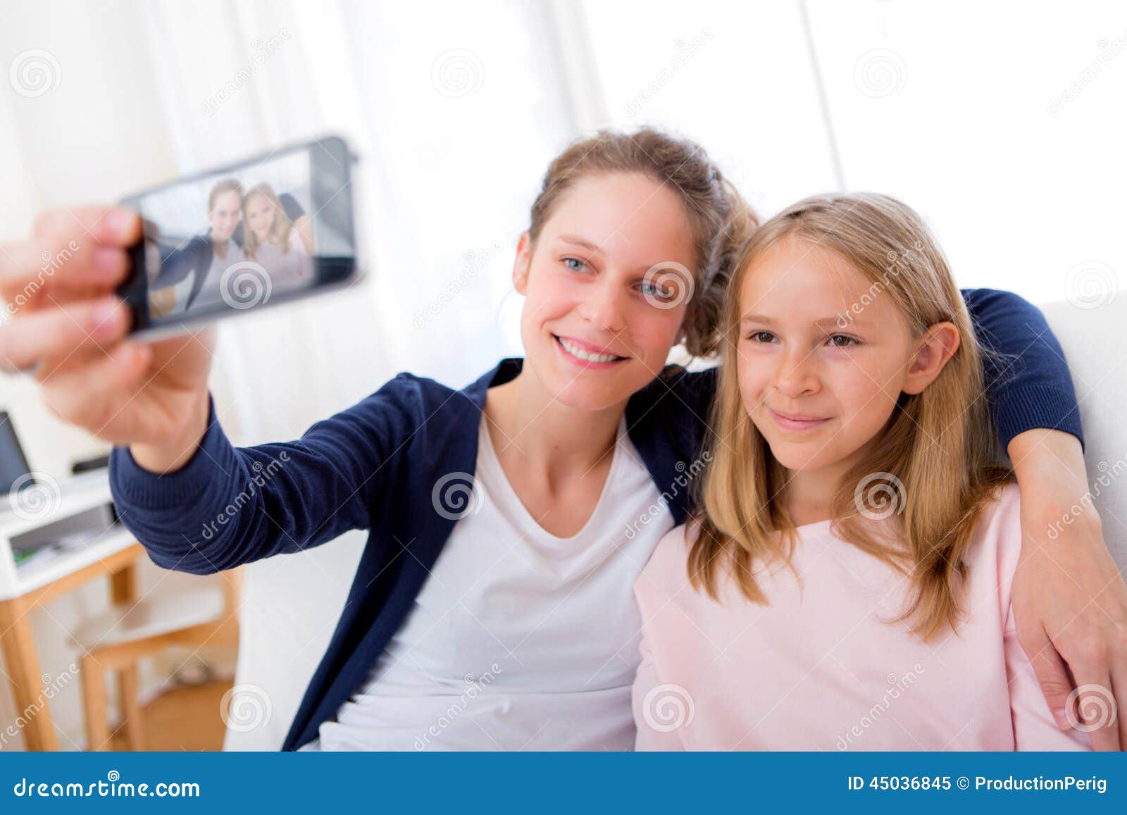 Attractive Woman and Little Sister Taking Selfie Stock Image - Image of ...