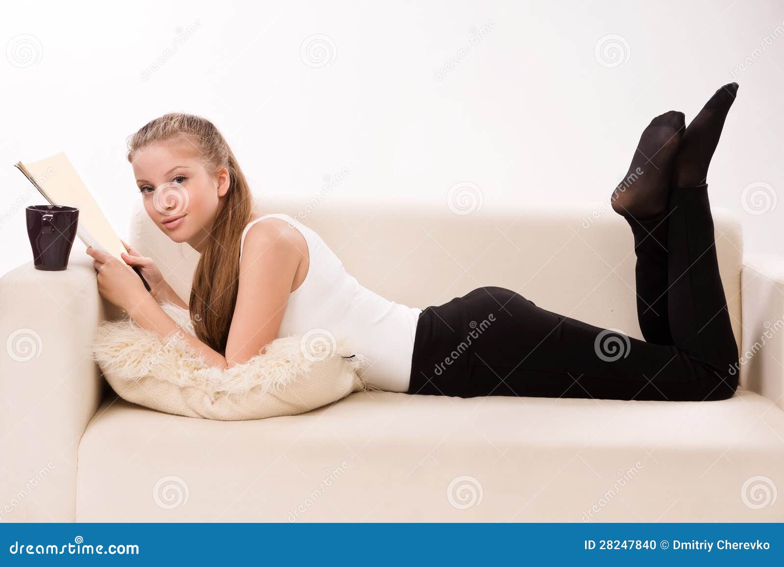 Attractive Woman Lying On A Sofa Stock Photo Image