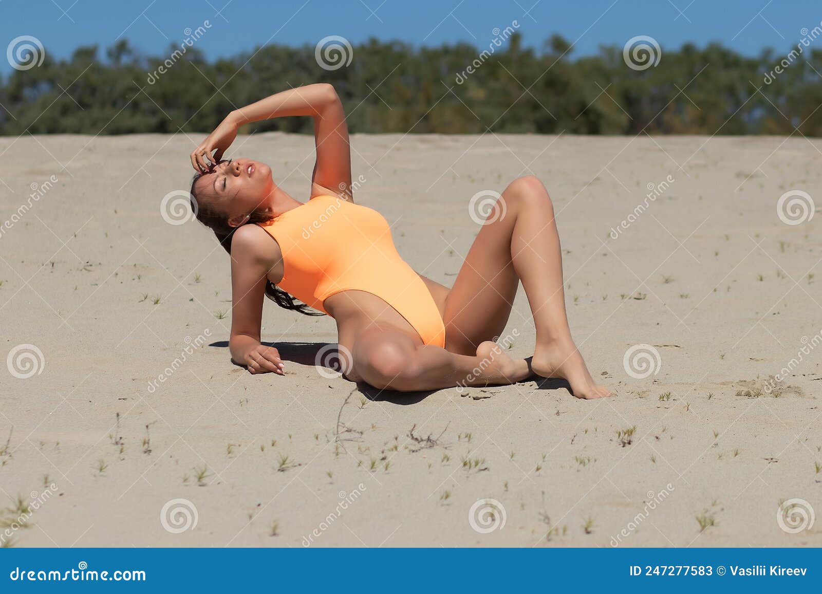 Attractive Woman in Swimsuit Relaxing on Beach Stock Image - Image