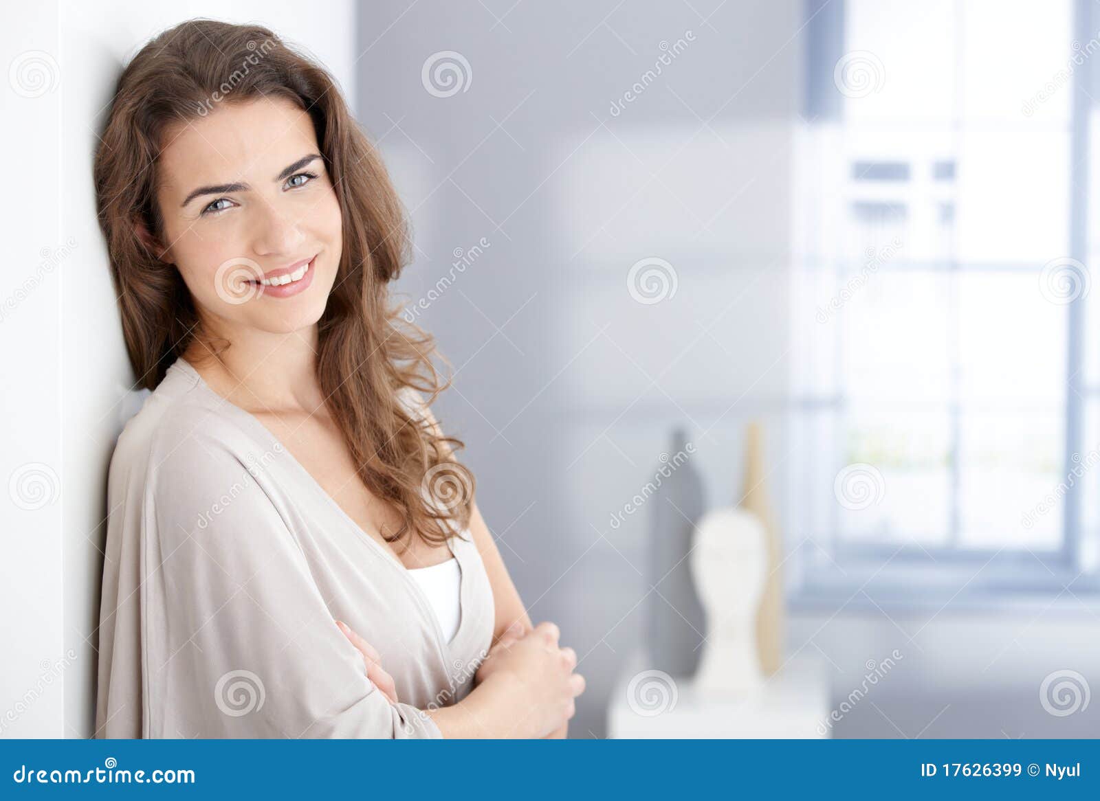 attractive woman smiling happily at home