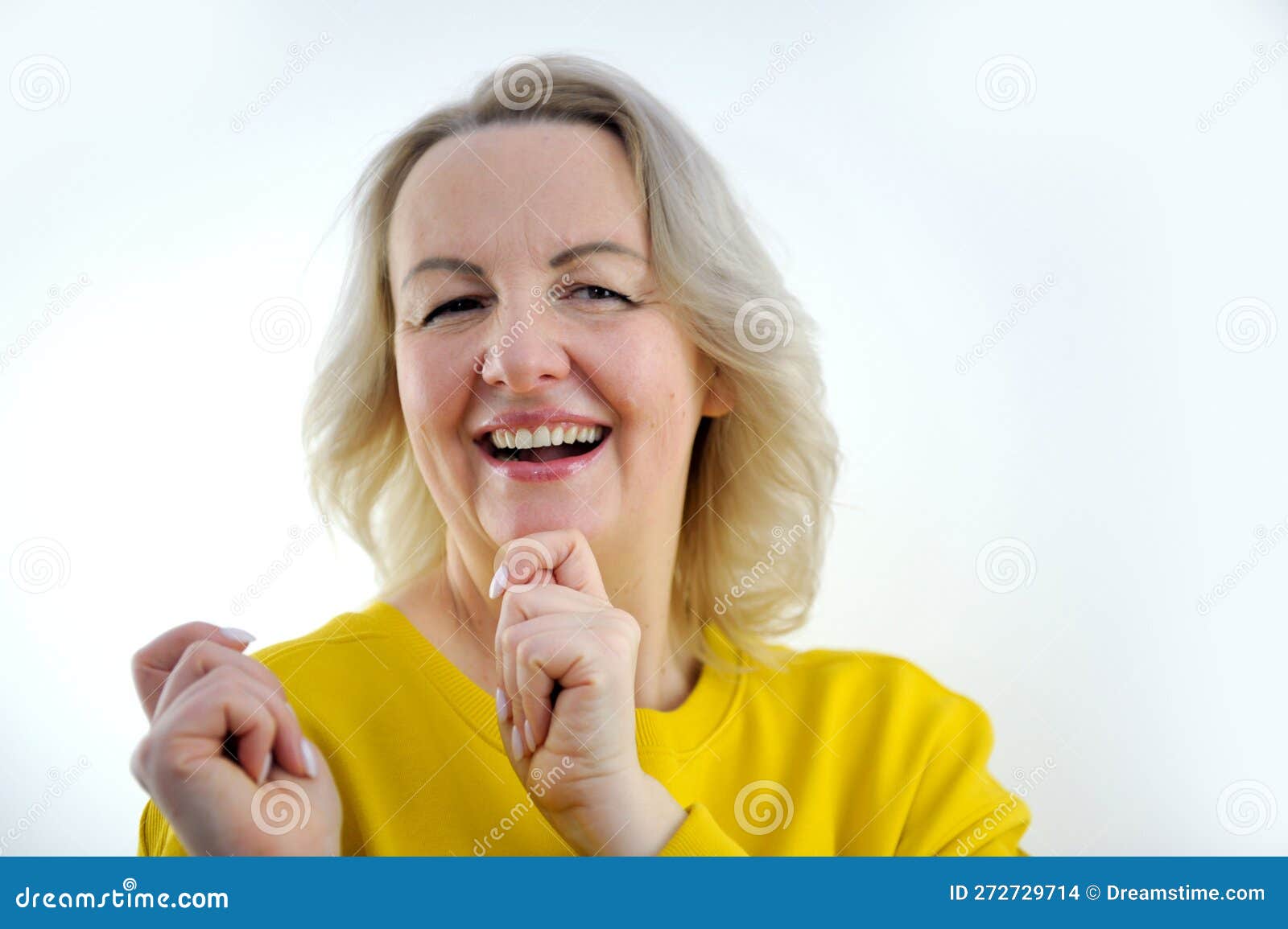 attractive woman wearing yellow t-shirt moving jumping forward with happy smiley face isolated on white background. High quality photo