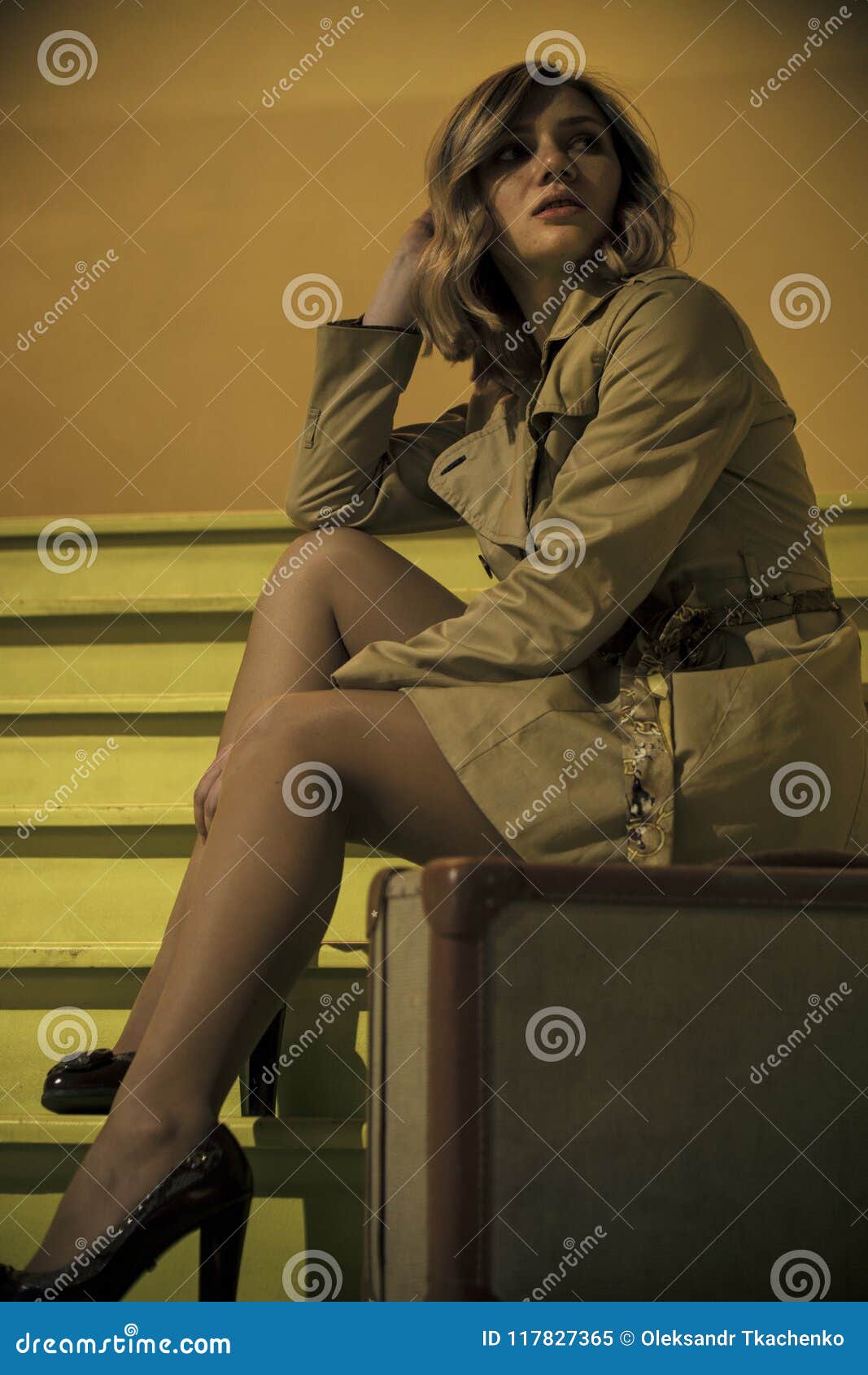 Attractive Young Blonde Woman in Trench with Vintage Suitcase on the ...