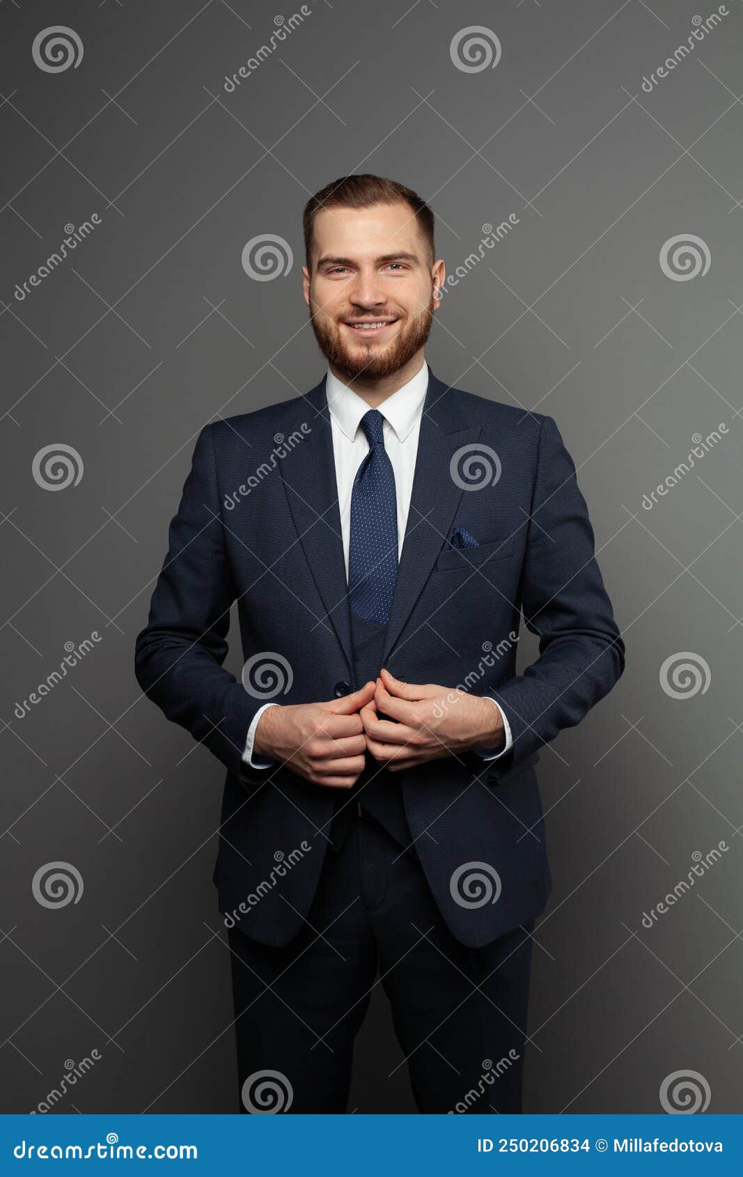 Attractive Young Businessman Wearing Suit on Grey Background Stock