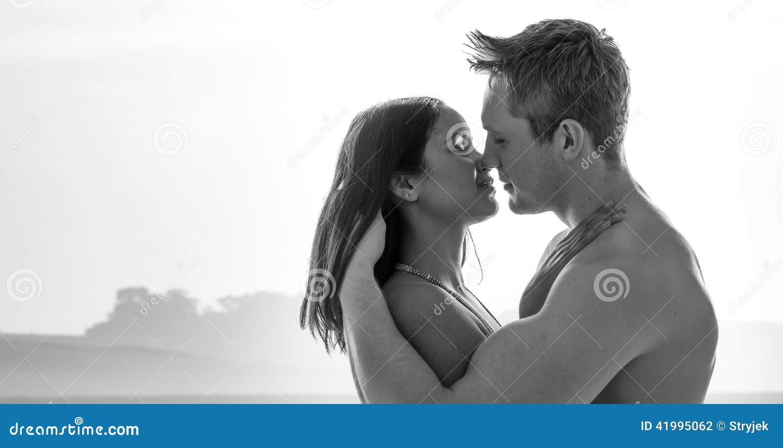 Attractive Young Couple Enjoying a Romantic Kiss Stock Photo ...