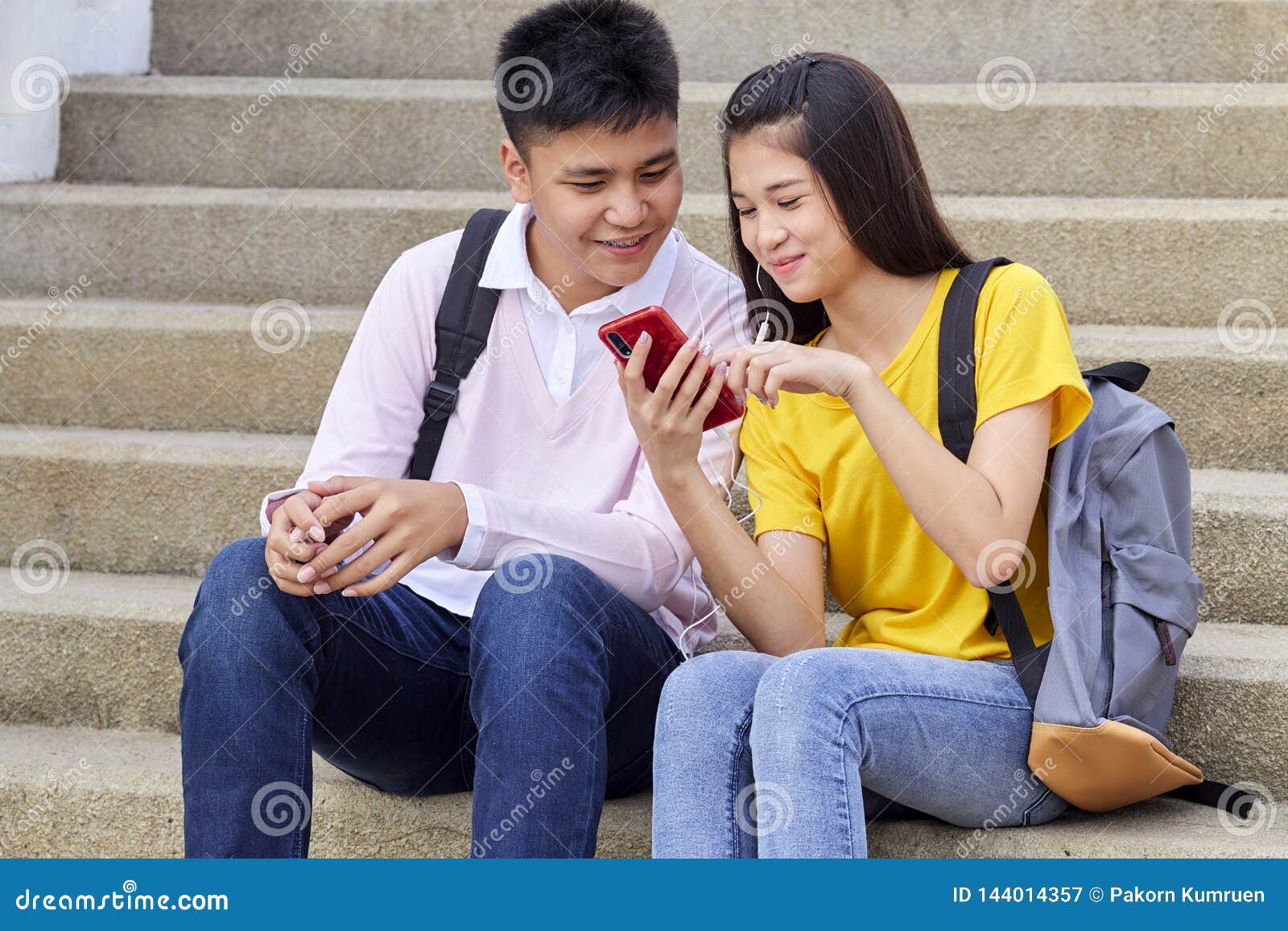 Attractive Young Couple Listening To Music Stock Image - Image of phone ...