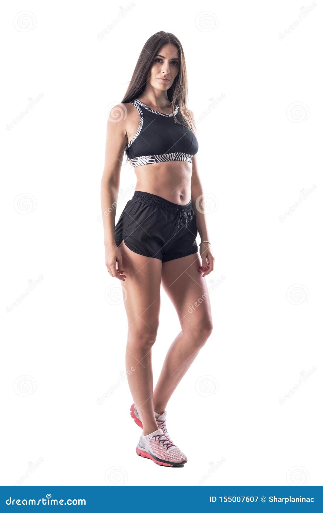 Attractive Young Fitness Woman in Black Top and Shorts Posing at Camera  with Blank Expression. Stock Image - Image of camera, athletic: 155007607