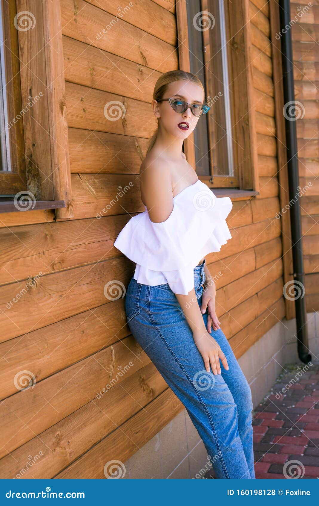 Attractive Young Girl with a Perfect Figure and Blond Hair in Trendy ...