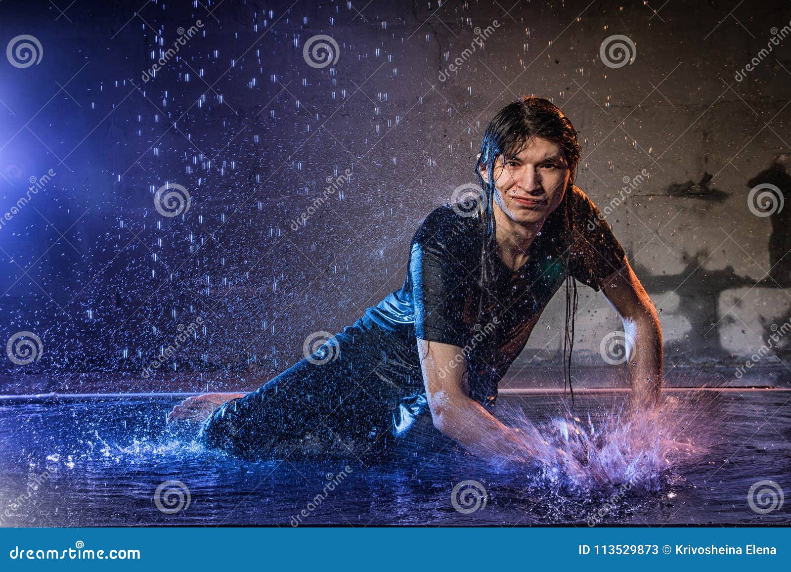 Attractive Young Man In Black Wet Clothes Under The Rain ...