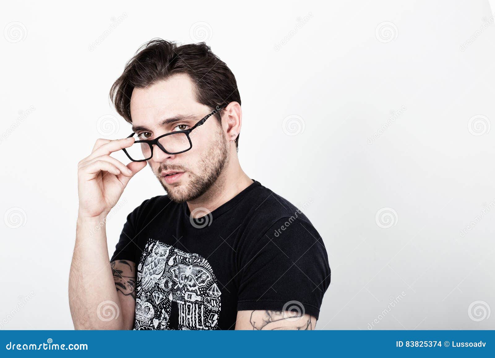 An Attractive Young Man with Glasses on White Background Looking Stock