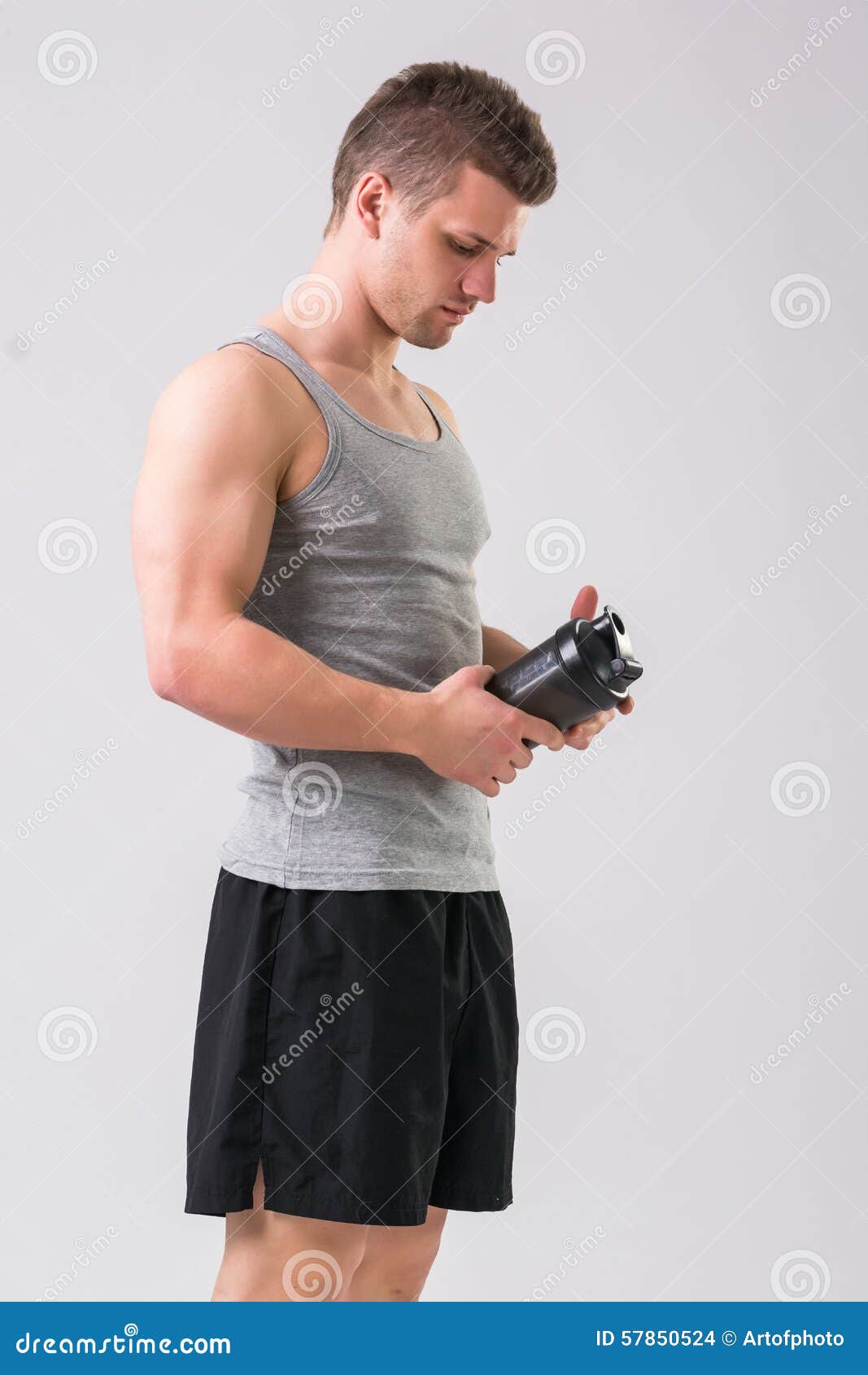Attractive Young Man Holding Protein Shake Bottle Stock Photo - Image ...