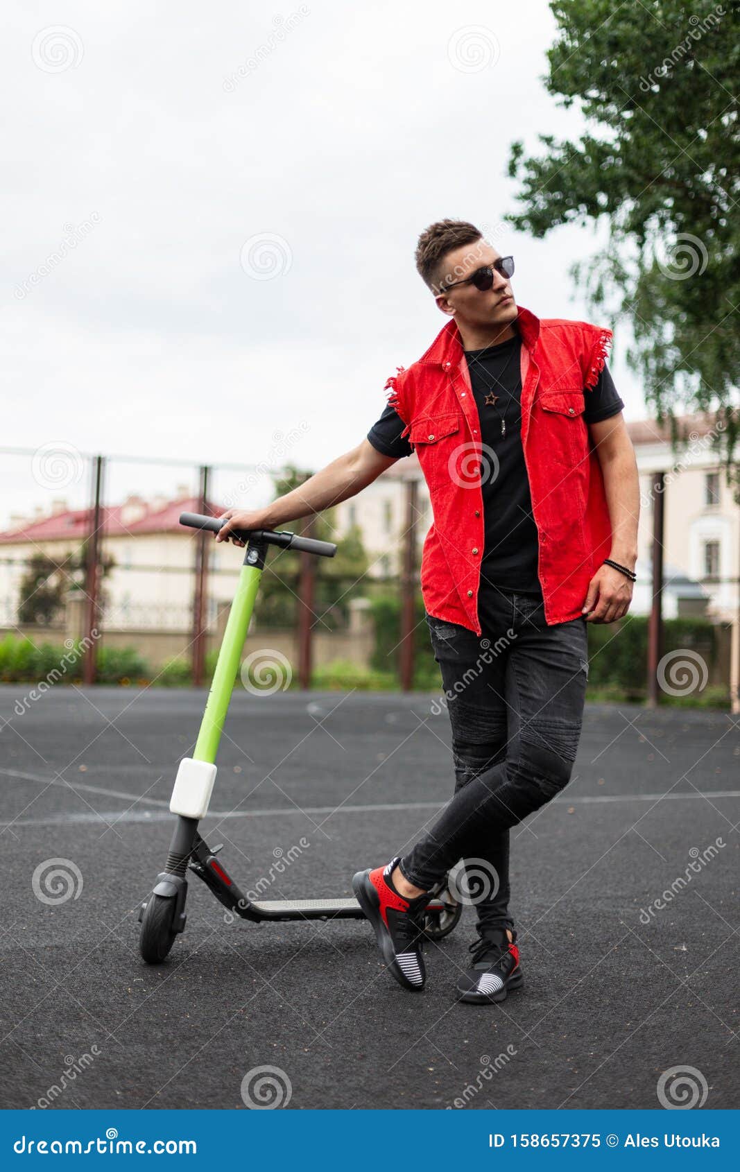 Attractive Young Man Model with a Vintage Electric Scooter in Fashionable  Denim Summer Black-red Clothes in Sunglasses Relaxes Stock Image - Image of  blackred, healthy: 158657375